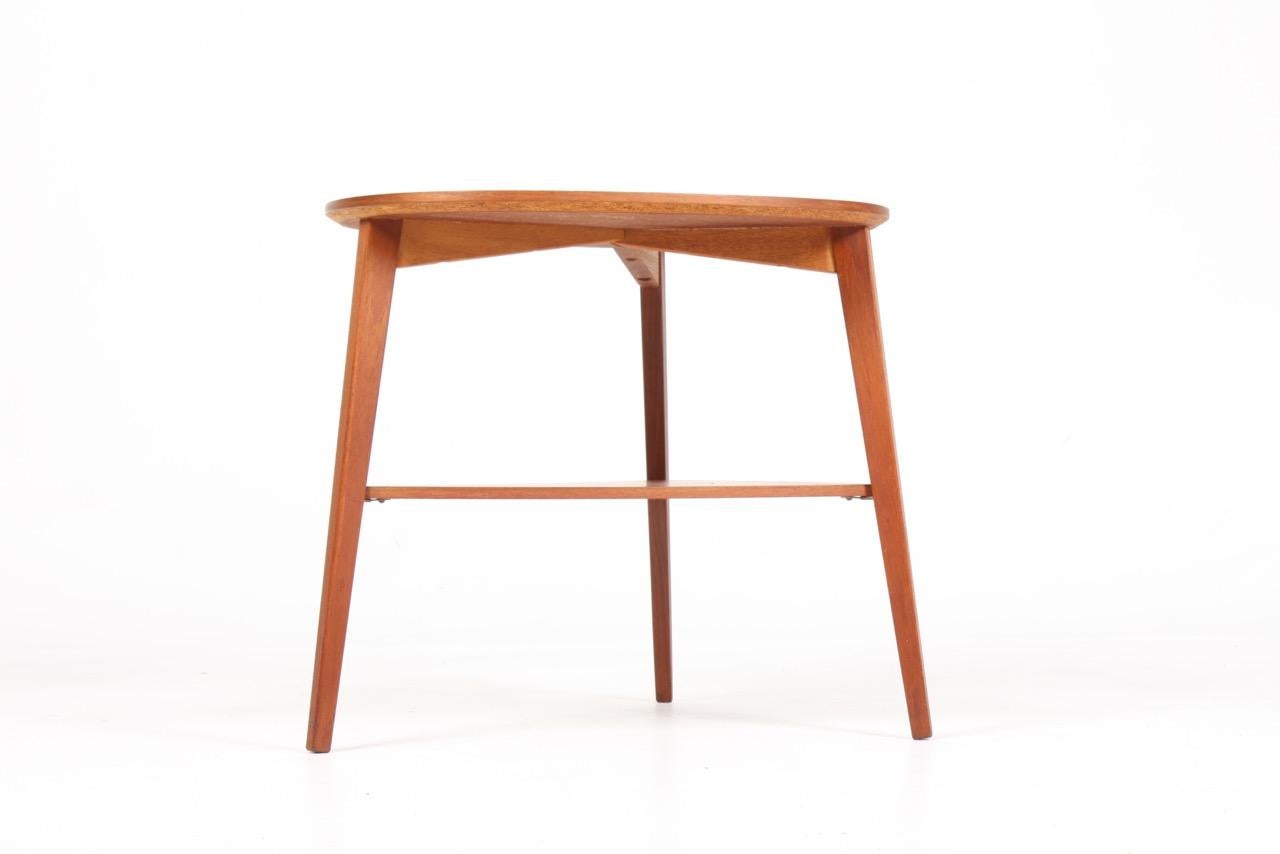 Elegant side table in teak. Designed and made in Denmark, 1960s. Great original condition.