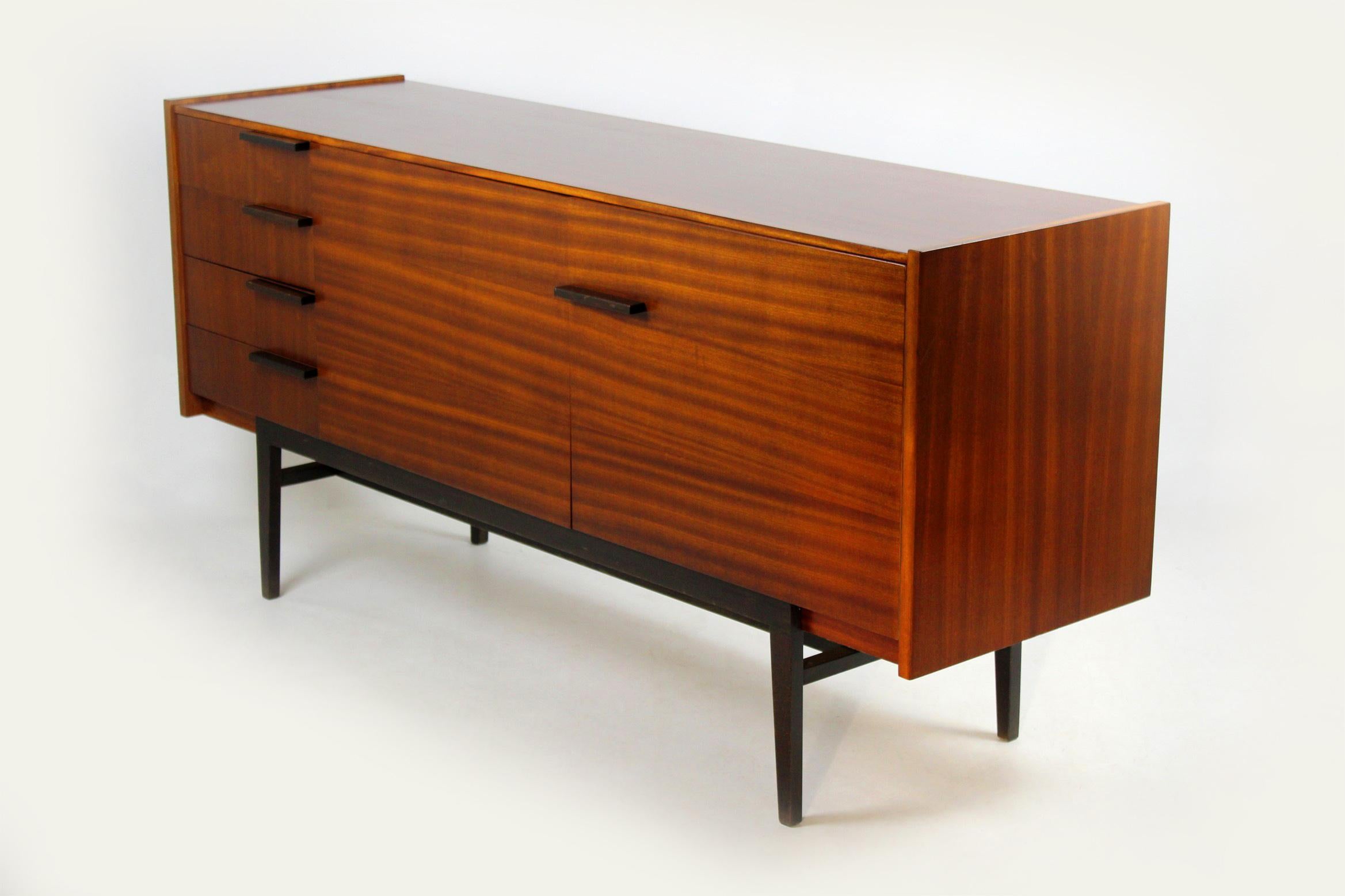 Midcentury sideboard, designed by František Mezulaník for UP Bucovice in former Czechoslovakia in the 1960s.
It features four drawers and two shelves.