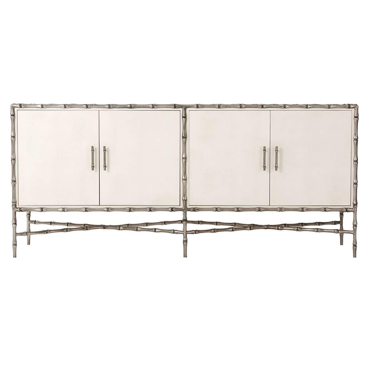 Mid-century sideboard with ivory shagreen embossed leather-wrapping and faux bamboo metal frame, legs, and X-form stretchers. 

Dimensions: 72