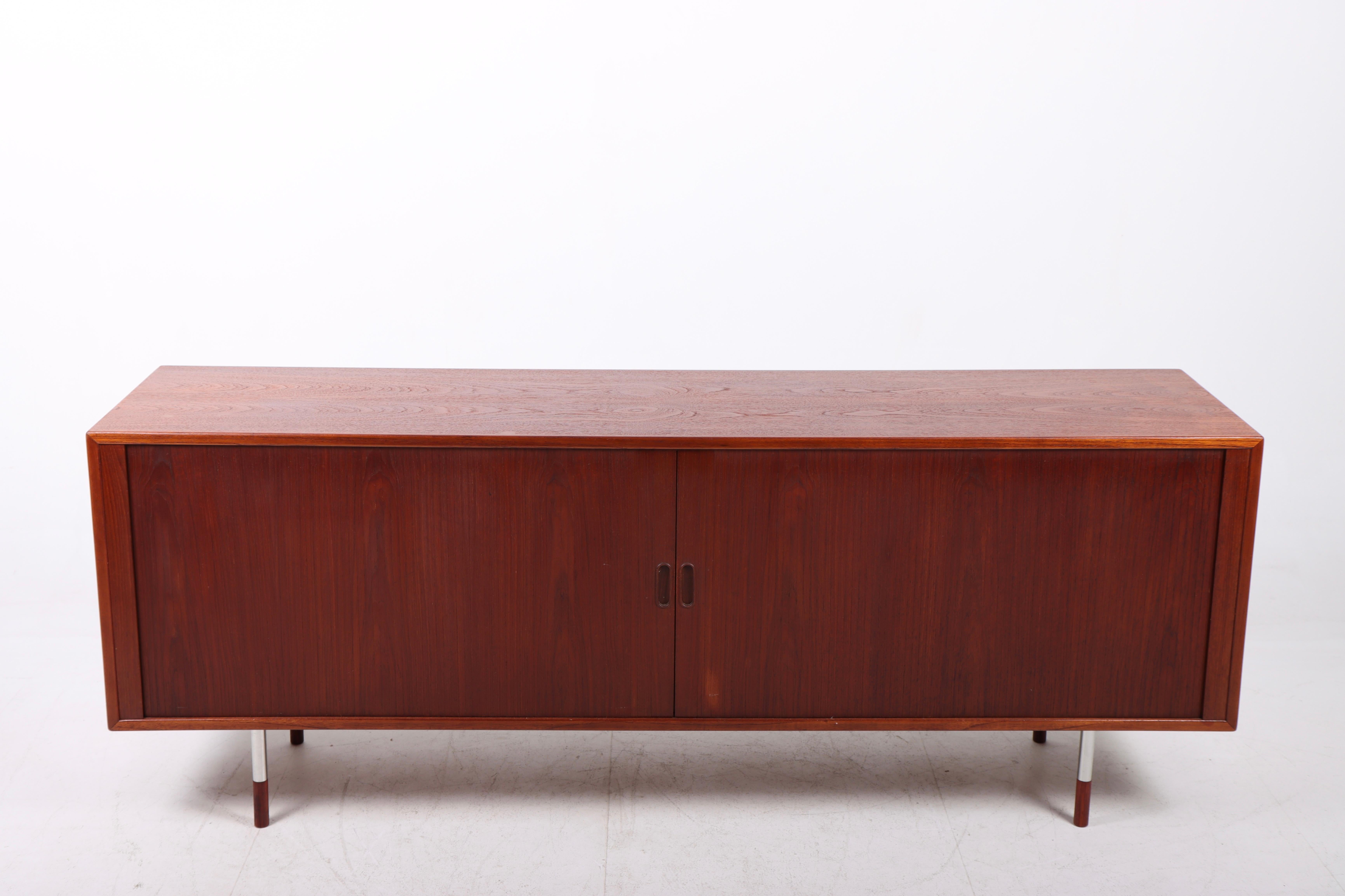 Sideboard in teak with tambour doors designed by Maa. Arne Vodder and made by Sibast furniture, 1960s. Great original condition.