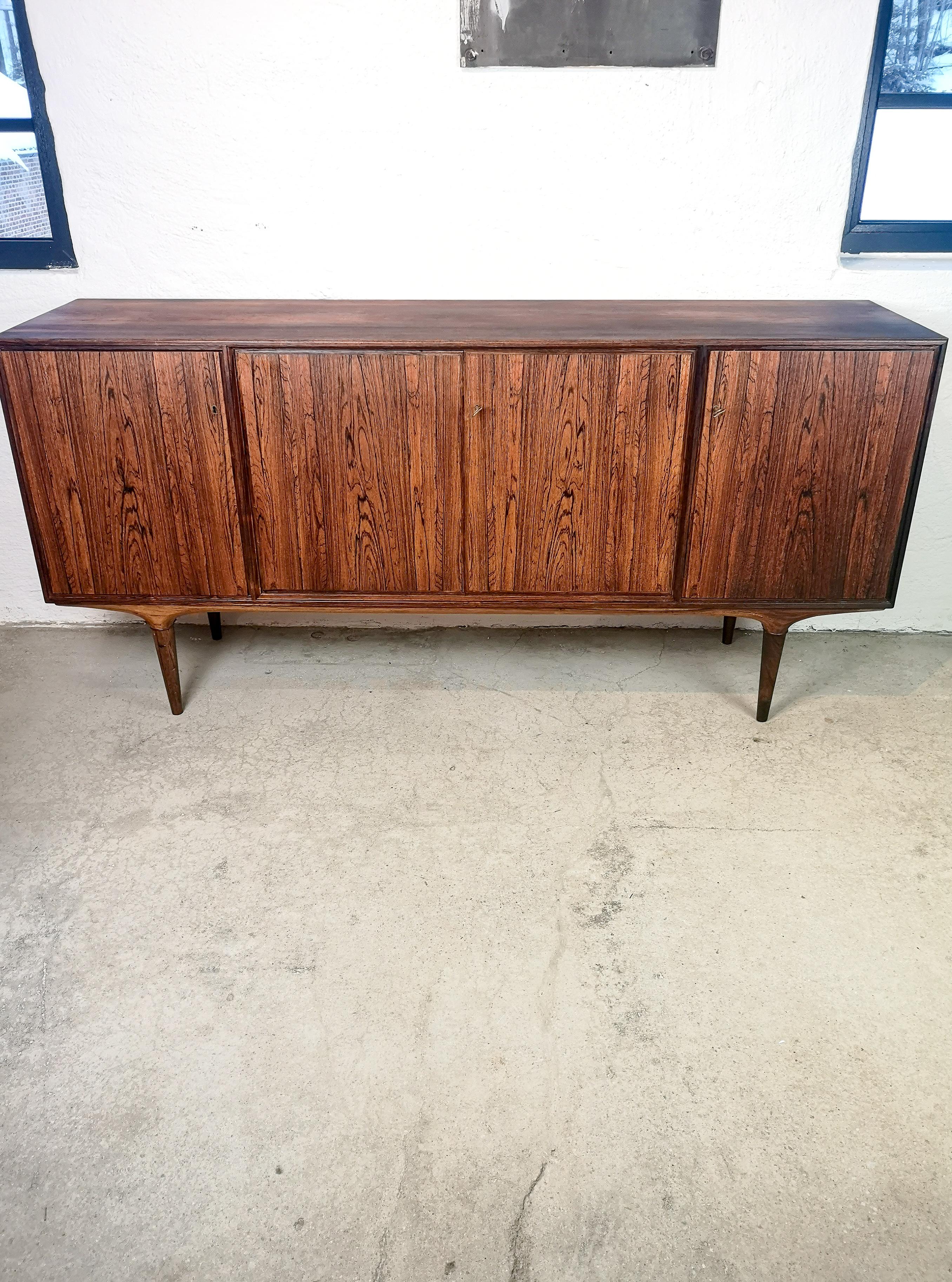 Nice sideboard in rosewood. Made at Seffle Möbelfabrik and designed by Svante Skogh in Sweden, 1960s.
The sideboard is made from rosewood with nice lines across the piece. This one has not brass rings at the legs as most of them have. Instead its