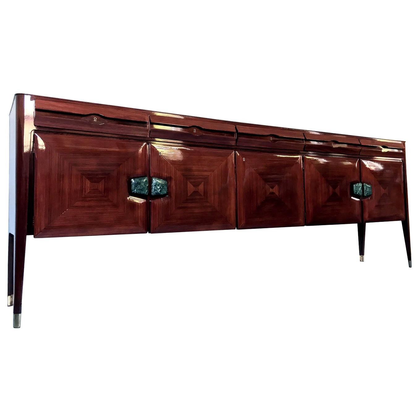Stylish Italian Sideboard designed by Vittorio Dassi in the 1950s, finished with fine marble handles.
It's in very good conditions of the period, it has been fully restored recently and now ready to use.
