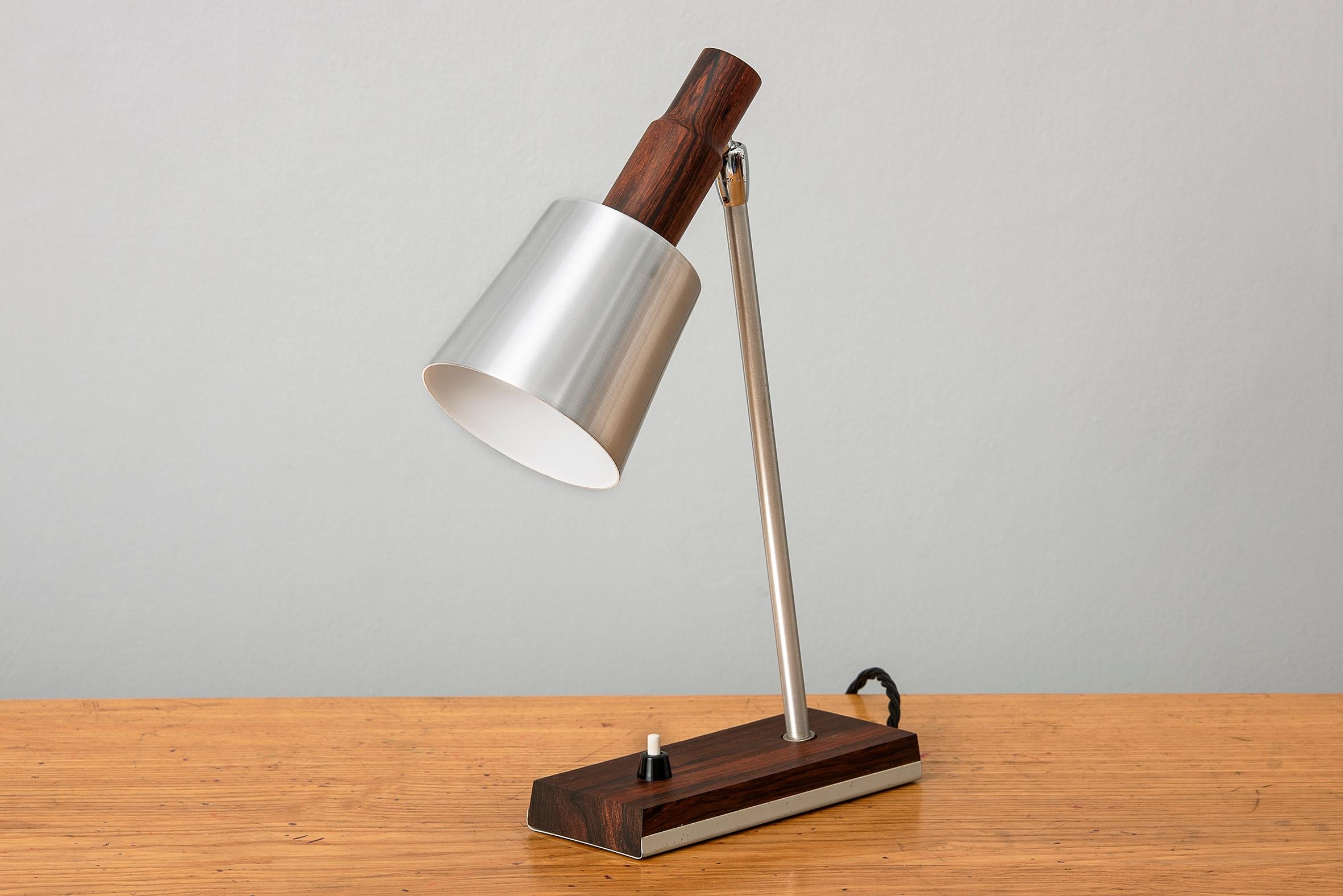 A rare example of this desk or table ‘silva’ lamp by Lyfa/OMI. Superb wood and steel and aluminium construction and multidirectional head. Rewired. A highly unusual piece as the cone wood top is turned, tapered and refined, unlike the typical
