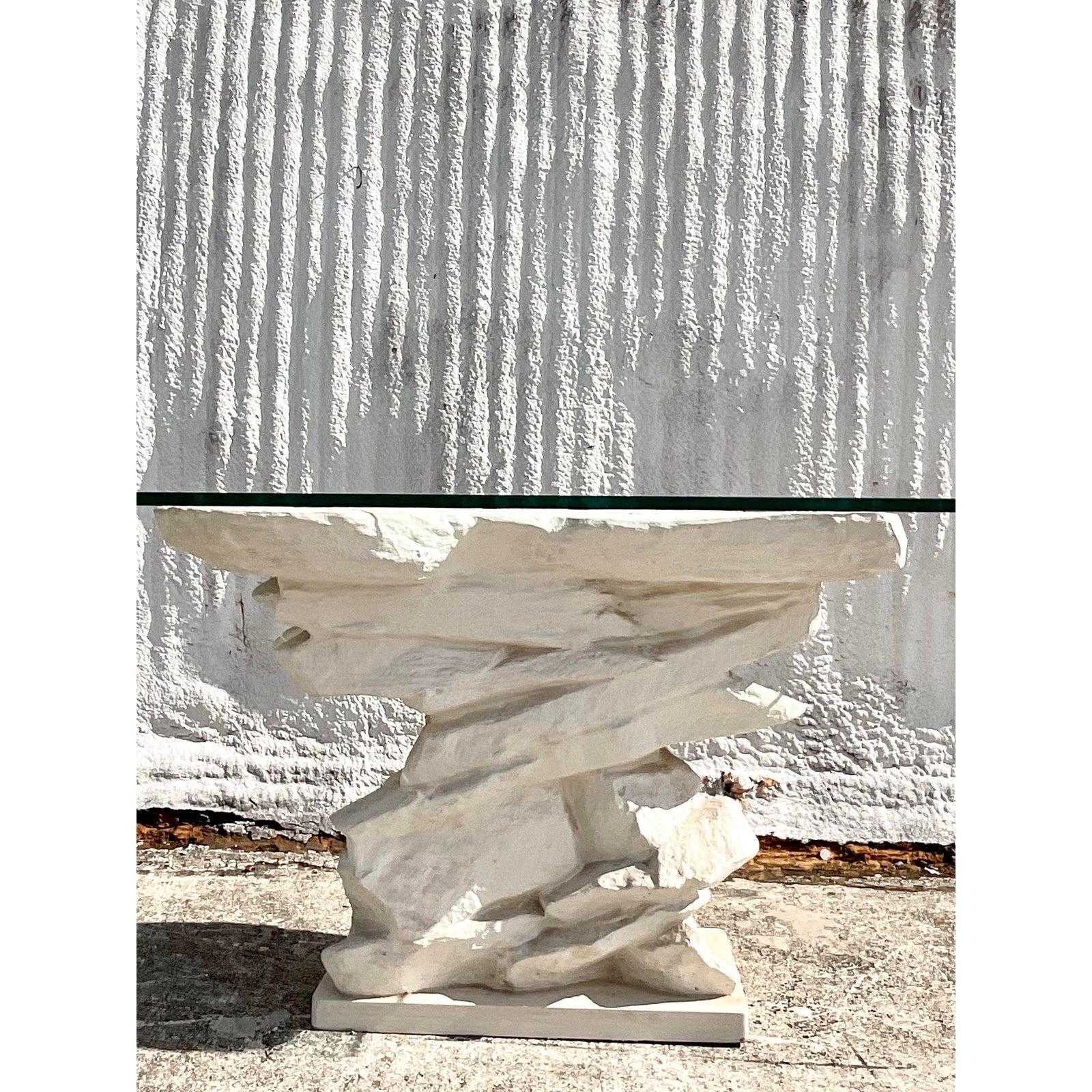 Incredible vintage white plaster console table. A stacked stone design made by the Sirmos group. Done in the manner of Emilio Terry. Glass top rests on surface. Acquired from a Palm Beach estate.