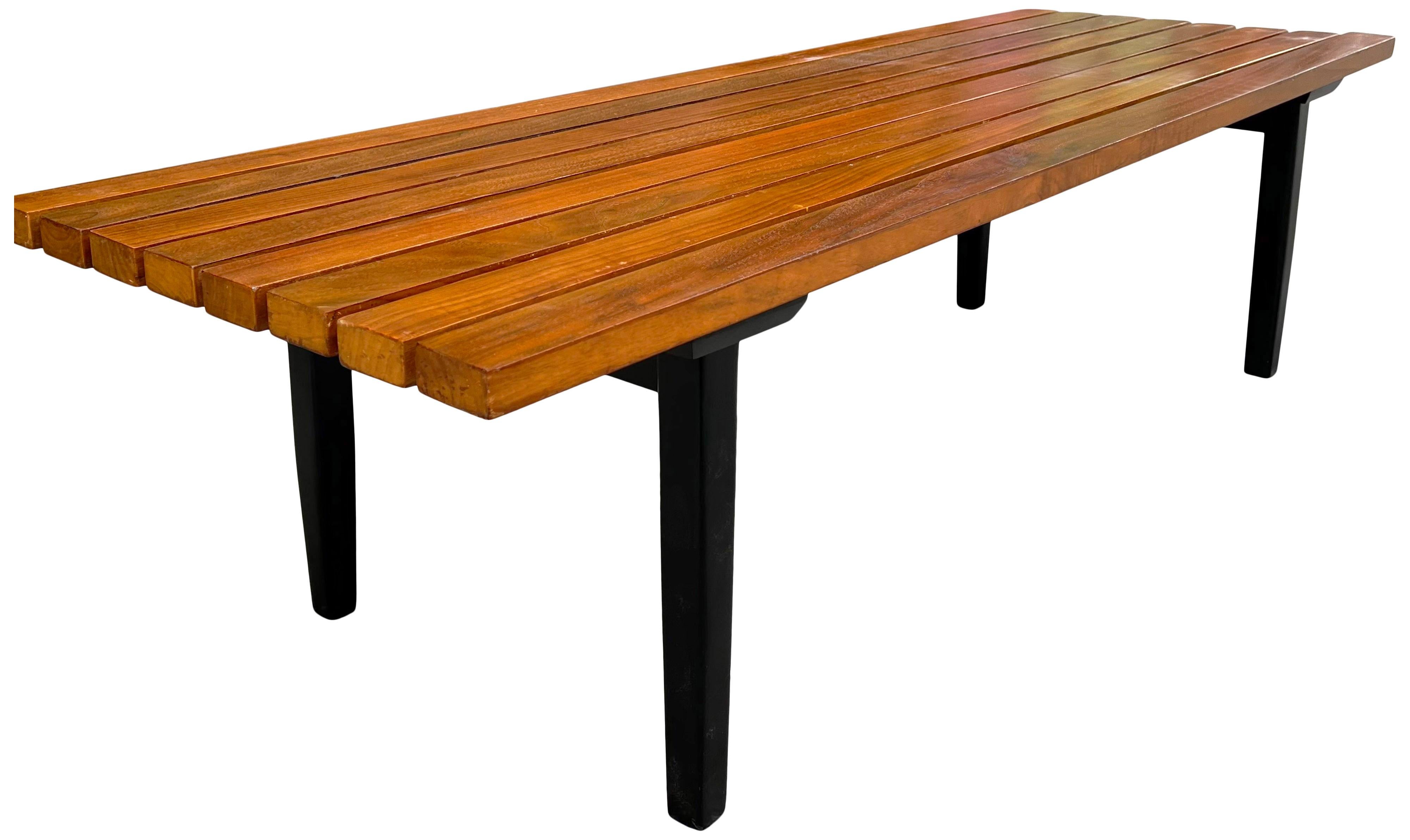 Beautiful slat bench or coffee table wood top on black Lacquer base. Superior construction and very sturdy having a larger then average depth to the stat top.

American mid century item with gorgeous patina and showing very little use.
