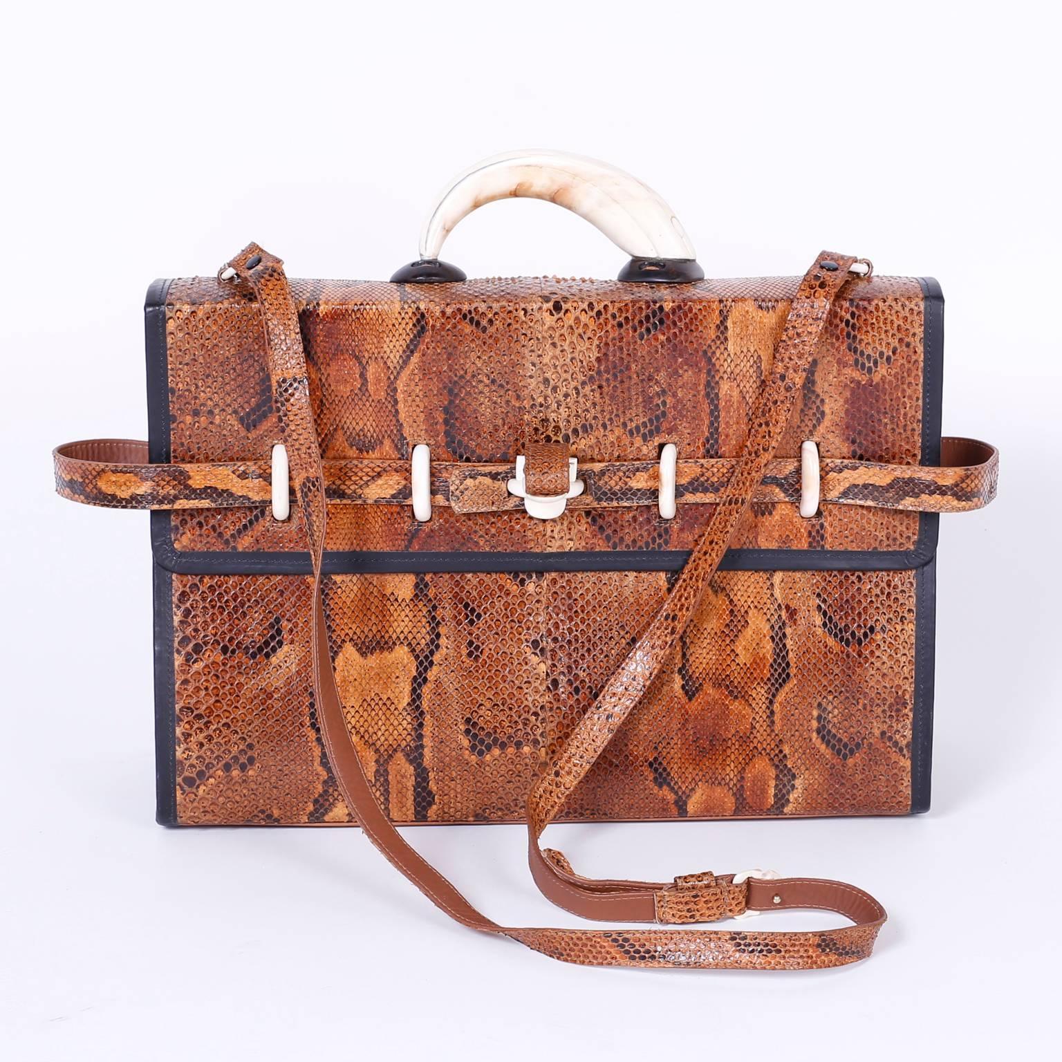 Exotic vintage shoulder bag, briefcase crafted in python skin with a bone handle and belt loops. Handmade by Lowell. Montreal.