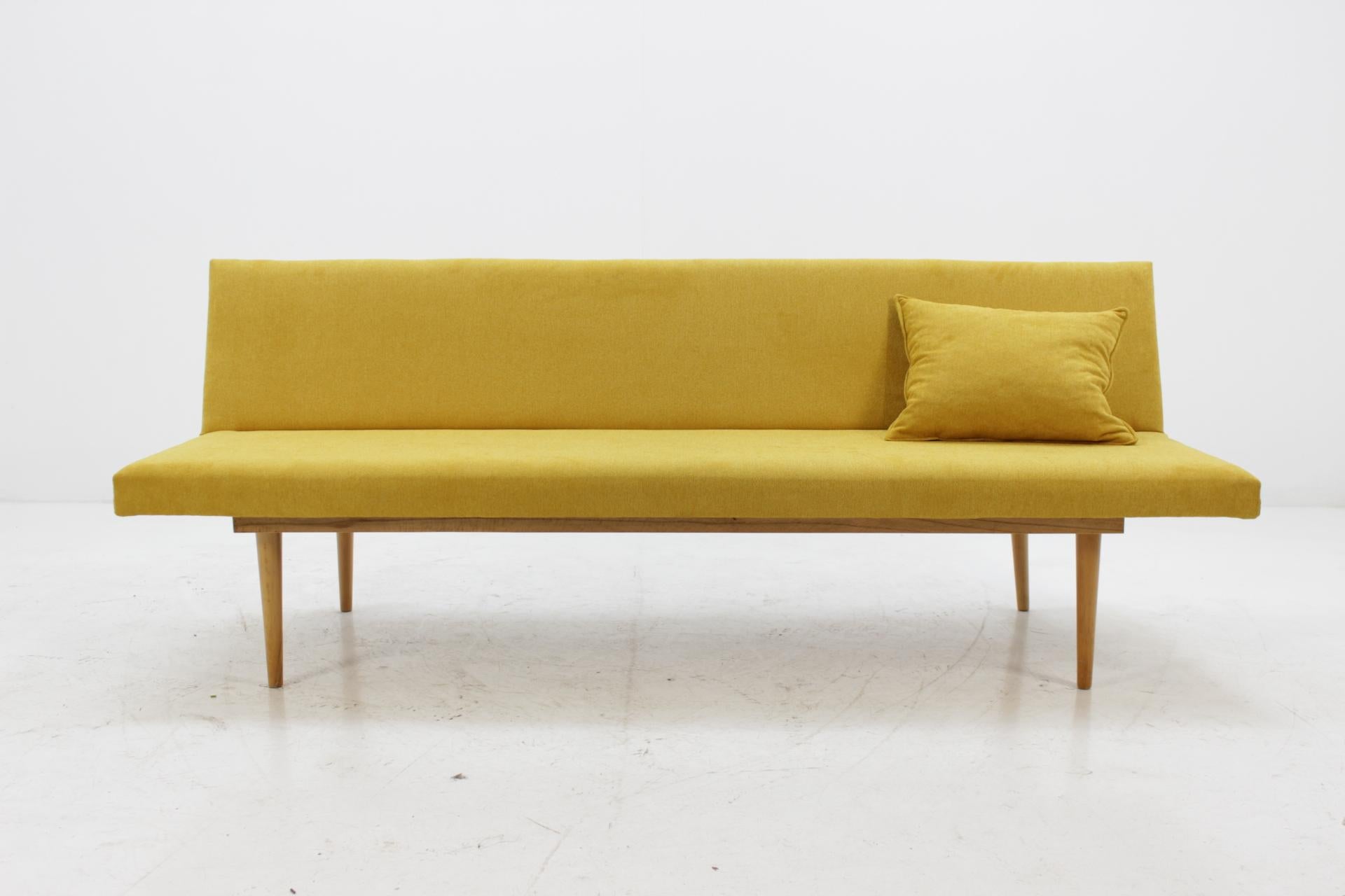 The item made of oakwood and has new upholstery. Dimensions folded sofa is 185 cm x 82 cm.