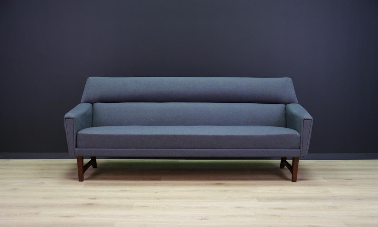 Original sofa from the 1960s-1970s. Beautiful straight line, Scandinavian design. Item upholstered with the new fabric, fantastic armrests. Legs made of rosewood. Preserved in good condition, directly for use.

Dimensions: height 79cm armrest,