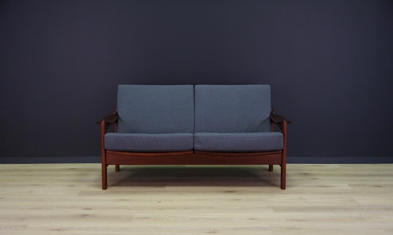 Phenomenal sofa from the 1960s-1970s, beautiful minimalist form, Scandinavian design. The sofa is covered with new upholstery. A phenomenal teak construction with beautiful armrests. Preserved in good condition (minor scratches on the structure),