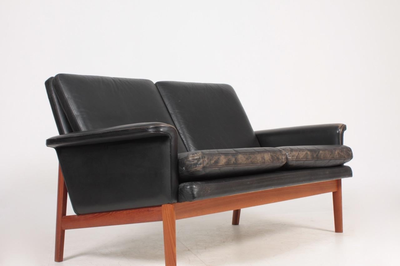 Great looking model 218 sofa in teak and original patinated leather by Maa. Finn Juhl, made by France & France, Denmark in the 1960s. Original condition.
