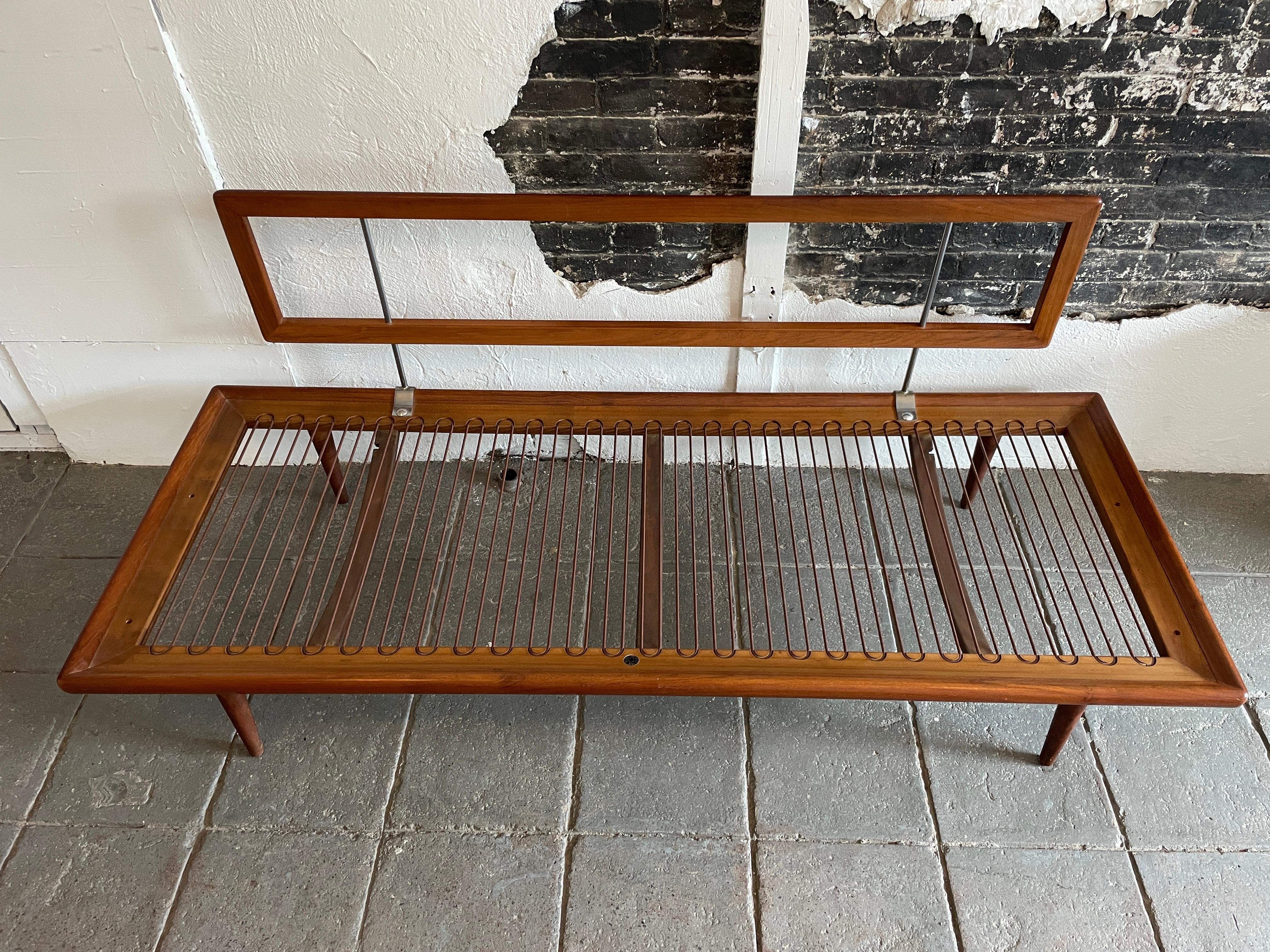 Iconic mid-century sofa or daybed in teakwood with chromed details. All hardware and springs are present. No Cushions and no side arms - holes are factory drilled if you want to hard arms . A day bed or sofa by Peter Hvidt & Orla Mølgaard-Nielsen