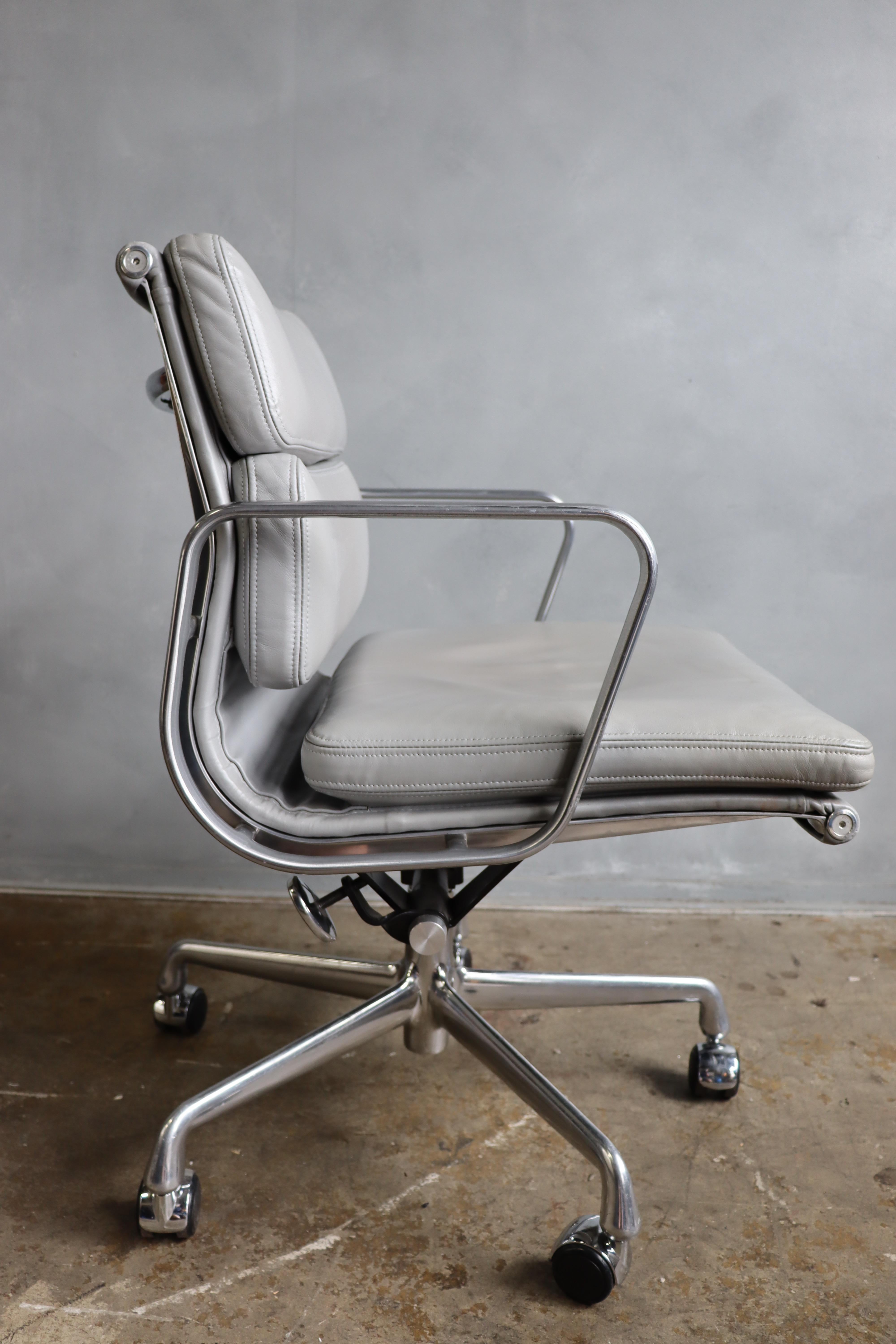 For your consideration is this authentic Eames for Herman Miller vintage soft pad chairs in silver / grey leather. Adjustable tilt on a 5 star base. These authentic vintage examples are icons of Mid-Century Modern design. These chairs are part of