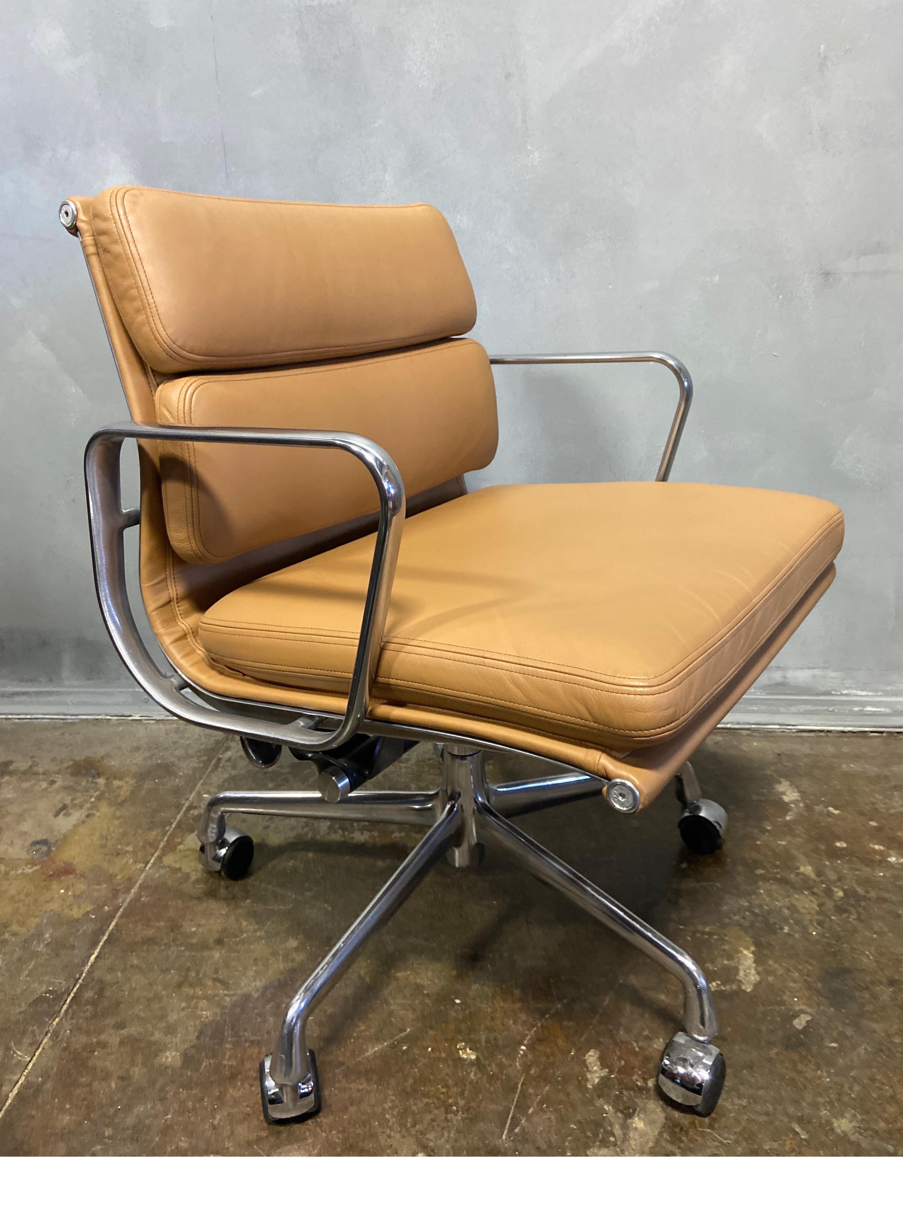 For your consideration are these authentic Eames for Herman Miller soft pad chairs in saddle brown leather. Adjustable tilt and height adjustment. These examples are icons of Mid-Century Modern design and in exceptionally good vintage condition.