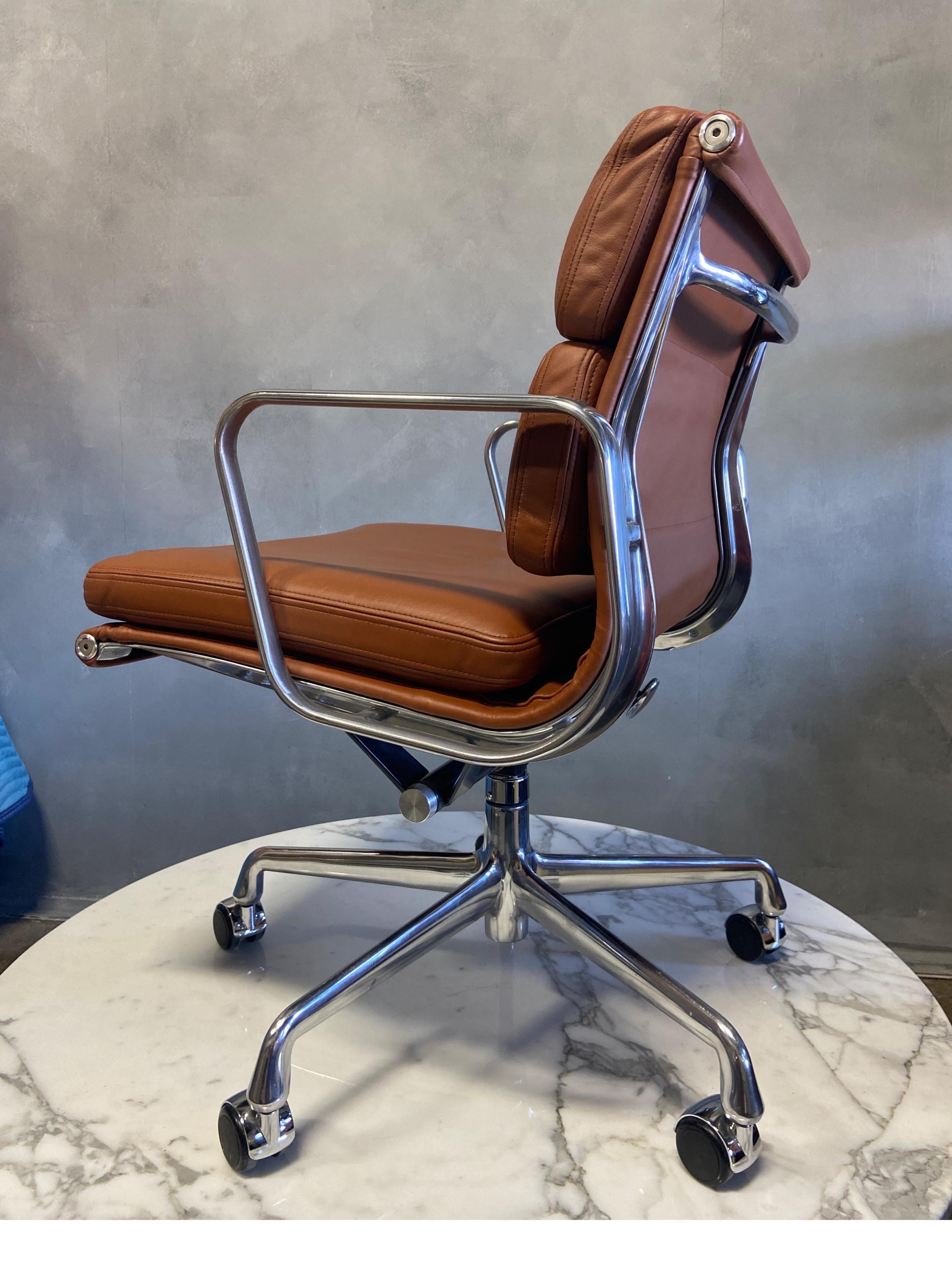 For your consideration is this authentic Eames for Herman Miller vintage soft pad chairs in brown leather. Adjustable tilt and height on a 5 star base. These authentic vintage examples are icons of Mid-Century Modern design. These chairs are part of