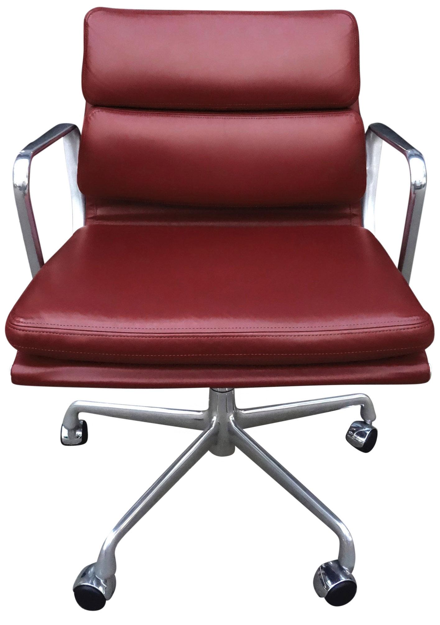 For your consideration at up to six Eames for Herman Miller vintage soft pad chairs in Burgundy leather with low backs. Adjustable tilt and height. 

These authentic vintage examples are icons of Mid-Century Modern design. The chairs part of the