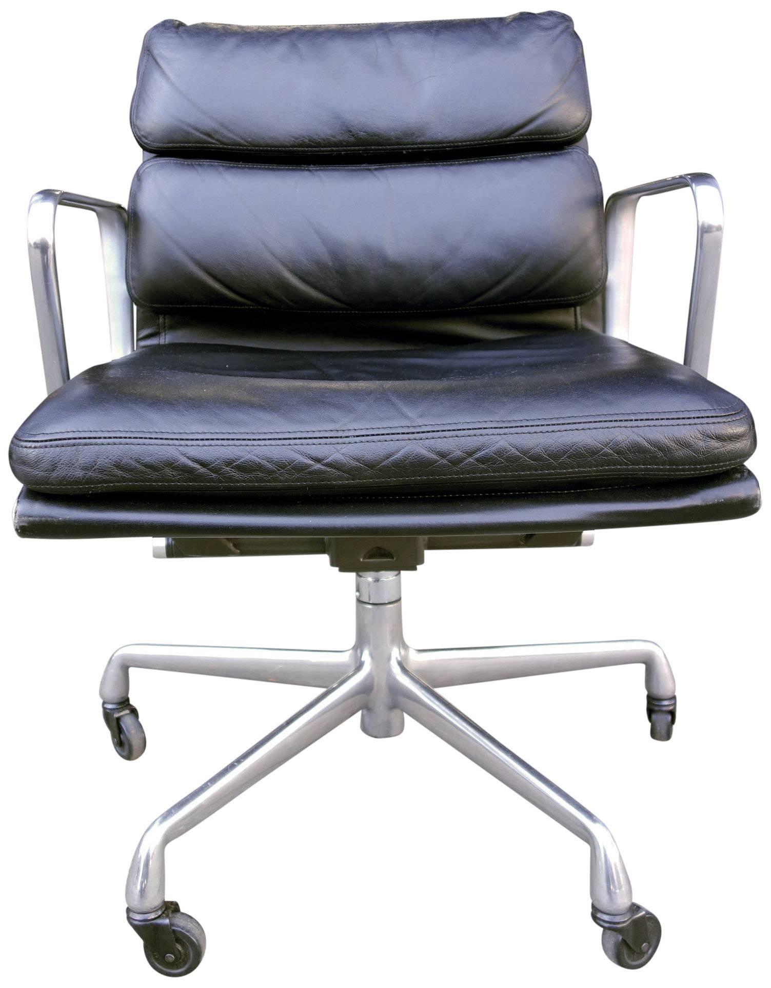 For your consideration are these Eames for Herman Miller vintage soft pad chairs in black leather with low backs. 

These authentic vintage examples are icons of Mid-Century Modern design. The chairs part of the Eames aluminium group designed for