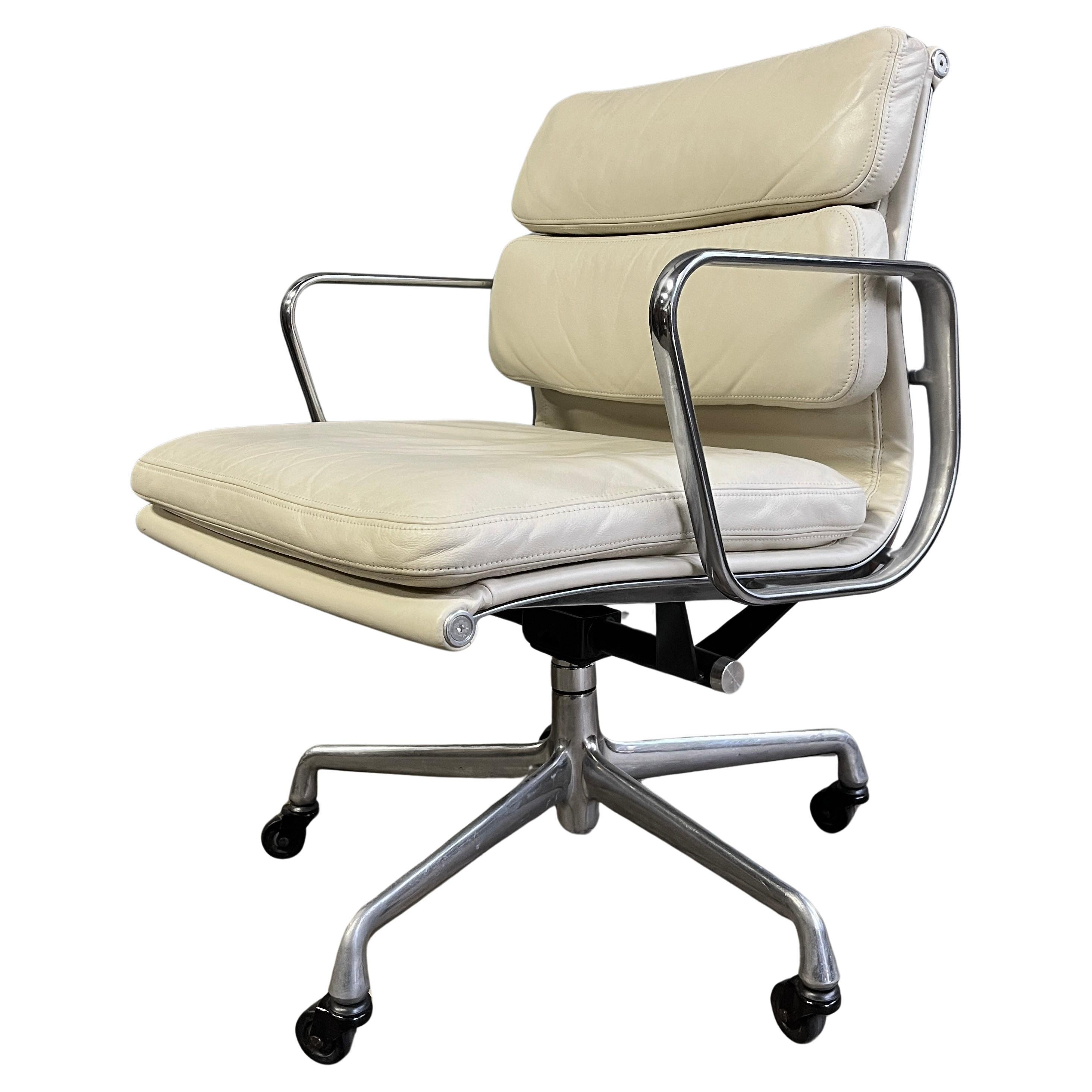For your consideration are these authentic Eames for Herman Miller vintage soft pad chair in white leather. Adjustable tilt and height with manual lift. This authentic vintage example are icons of Mid-Century Modern design. The chair part of the