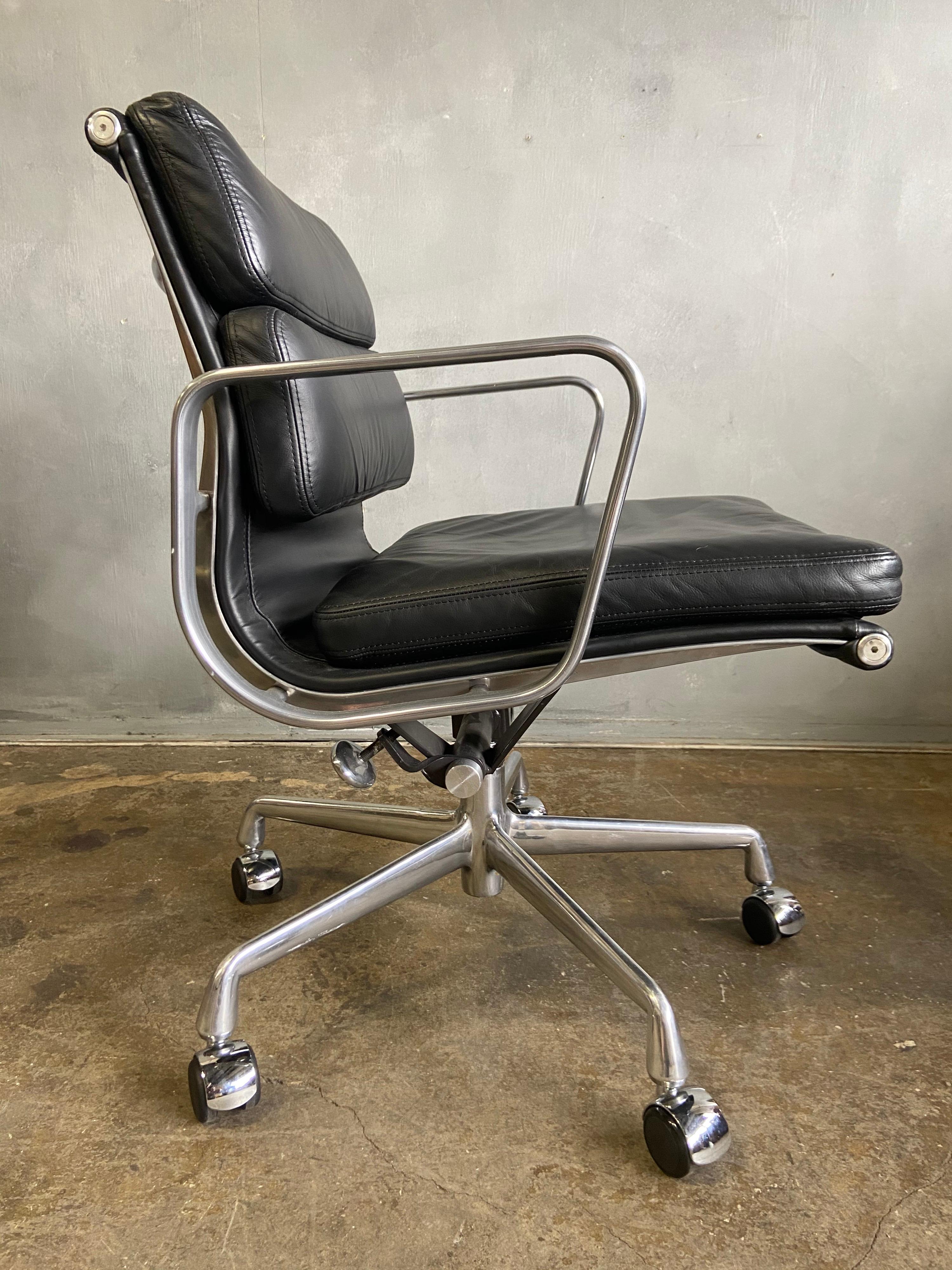 For your consideration we have up to 50 Eames for Herman Miller Soft Pad chairs in black leather with low backs. With classic tilt and manual height adjustment. 
These authentic vintage examples are icons of Mid-Century Modern design. The chairs