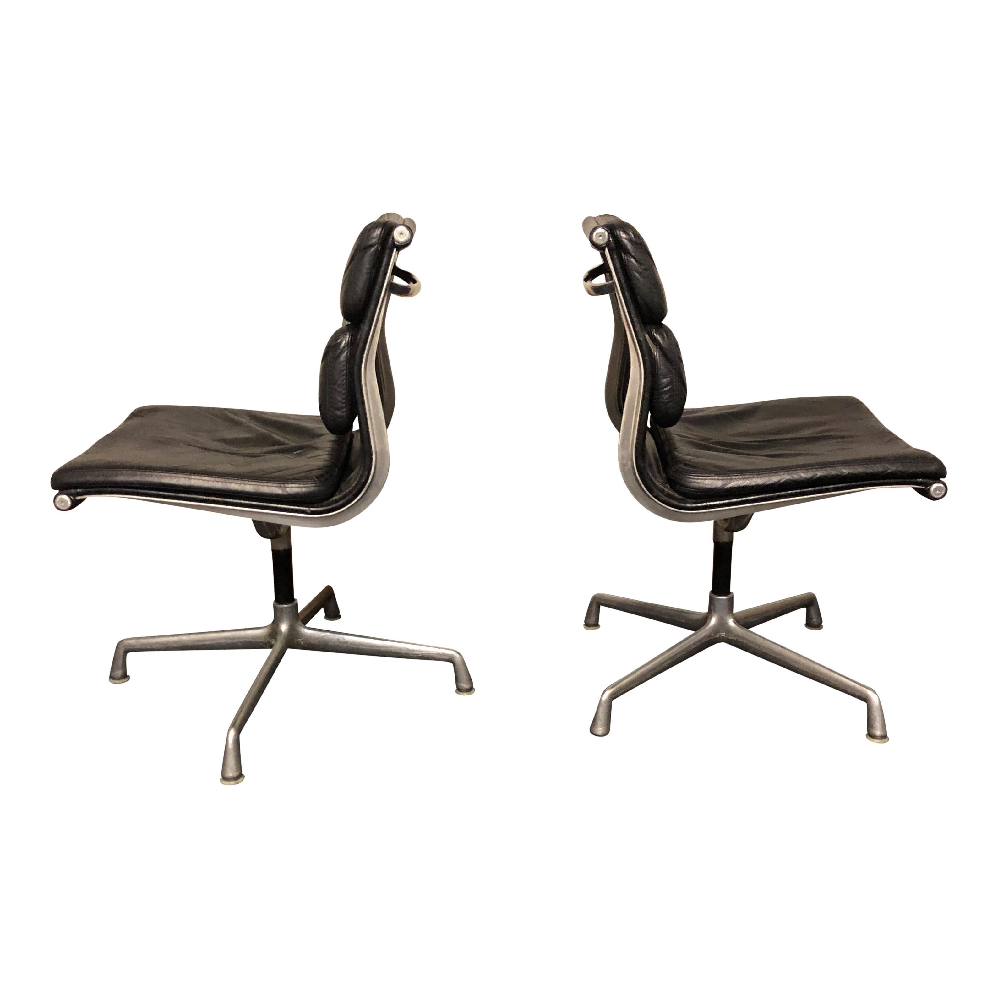 For your consideration are authentic Eames for Herman Miller vintage soft pad chairs in black leather. 

These authentic vintage examples are icons of Mid-Century Modern design. The chairs part of the Eames aluminium group designed for Herman