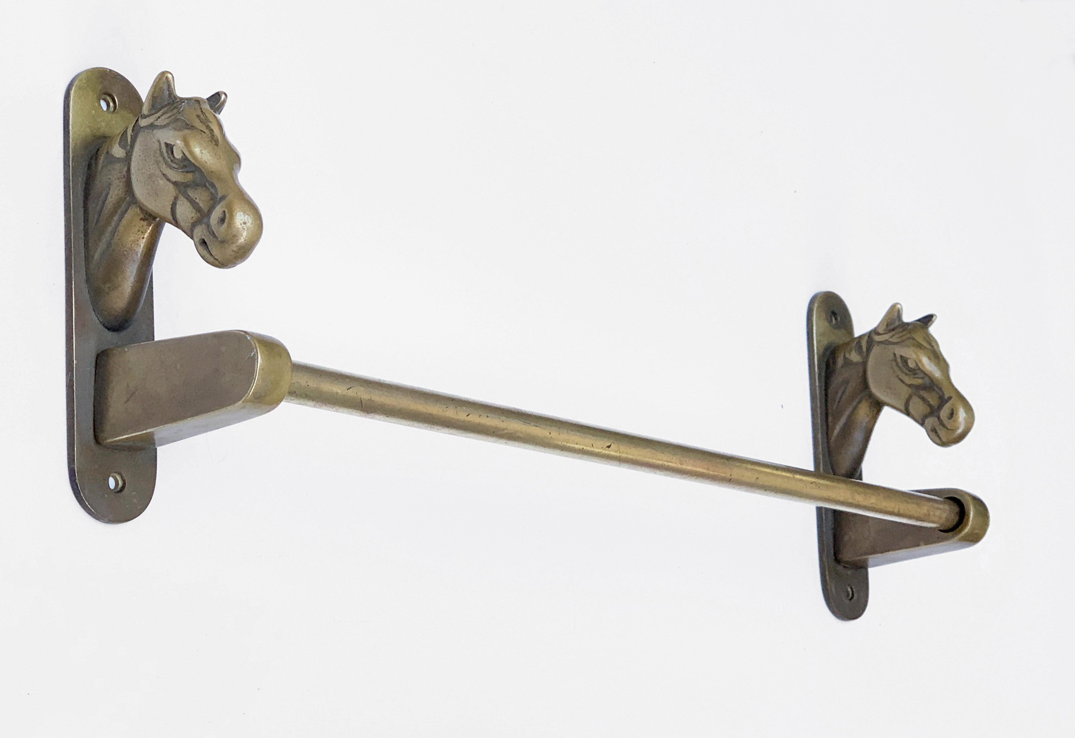 Wonderful bathroom fixture: a brass towel rack with horse heads on the extremities. 

It is made of three solid brass pieces, the two horse heads and the rack. 

It was made in Italy during 1950s. This piece is perfect for a countryside project