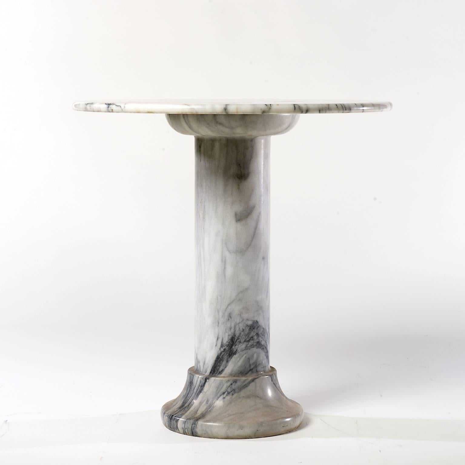This midcentury solid marble side table was made circa 1975.
The marble has a beautiful structure and some lovely details.