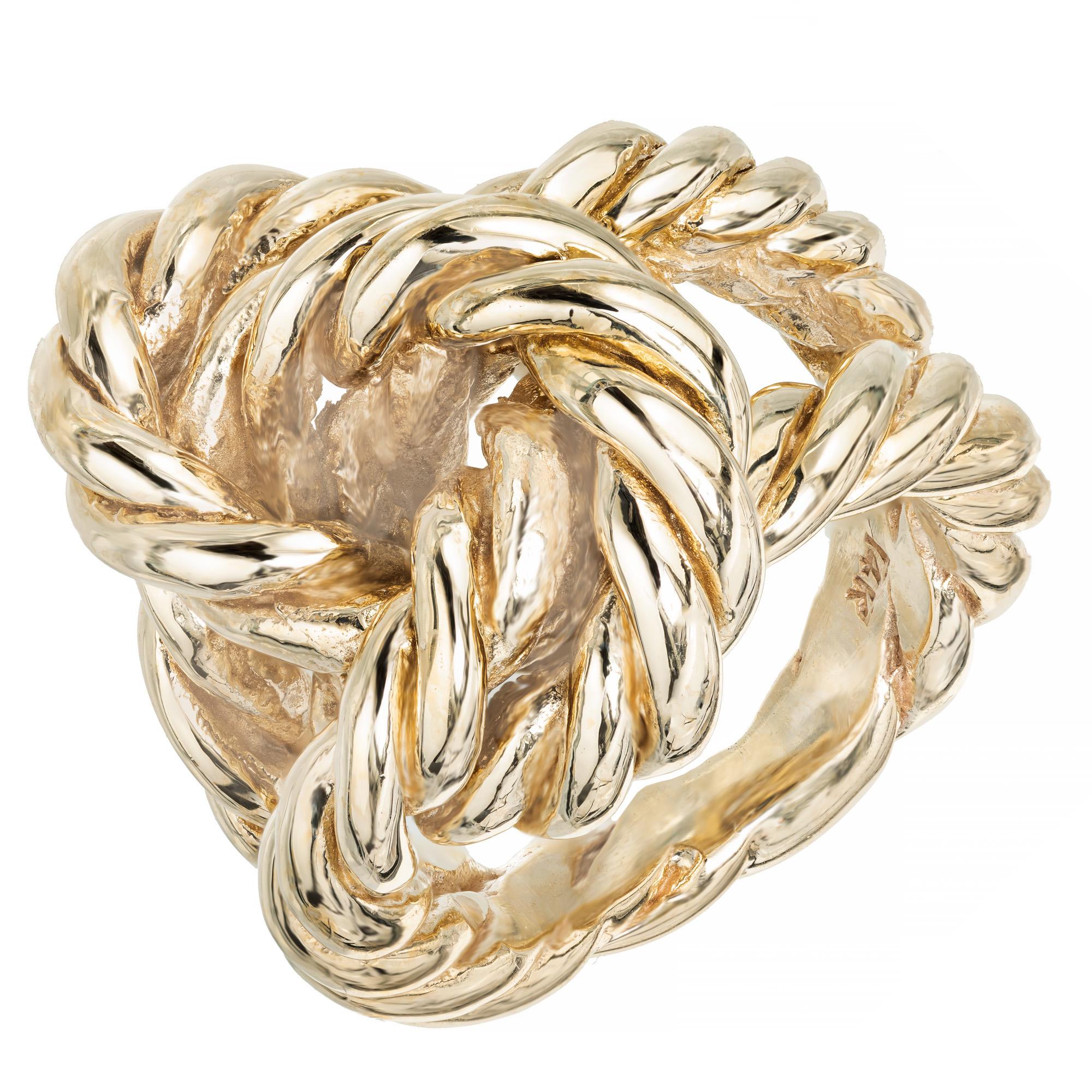 Heavy solid 3 dimensional 1950s knot cocktail ring. Twisted rope 14k yellow gold.

Size 5.5 and not easily sizable
14k yellow gold 
23.4 grams
Tested and Stamped: 14k
Width at top: 15.2  
Width at bottom: 4.30 
