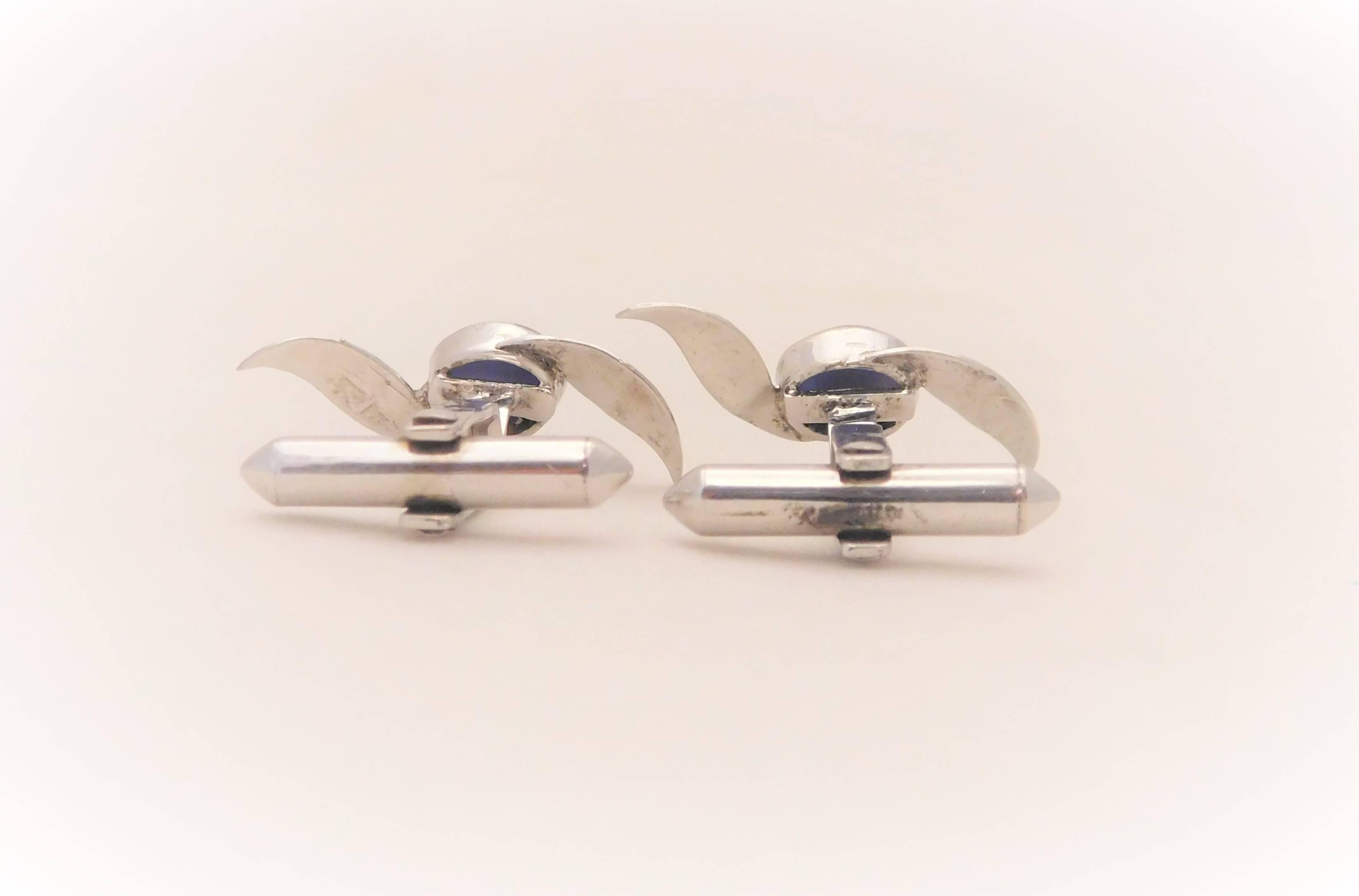 From stately uptown New Orleans estate.  Circa Mid 20th Century.  This dashing pair of cufflinks have been crafted in 18k white gold.  Each piece has been masterfully jeweled, in a bezel setting, with a six-ray natural blue star sapphire cabochon