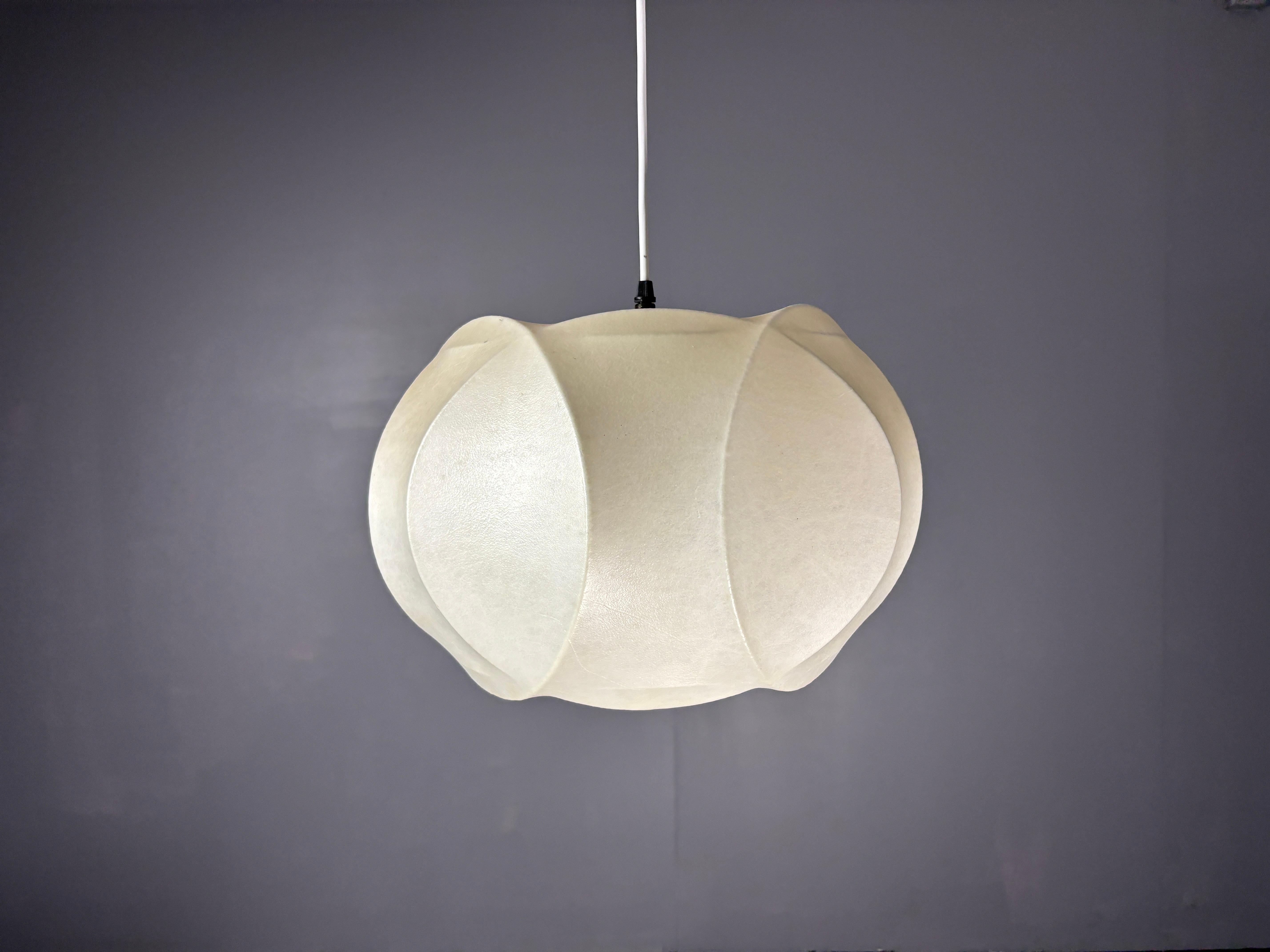 Gorgeous cocoon pendant in the style of Castiglioni but most likely by renowned German cocoon lamp maker Goldkant. Finding these cocoon lamps in this shape are rare ( most cocoons are round ) Its in a good vintage condition,no rips, tears but just