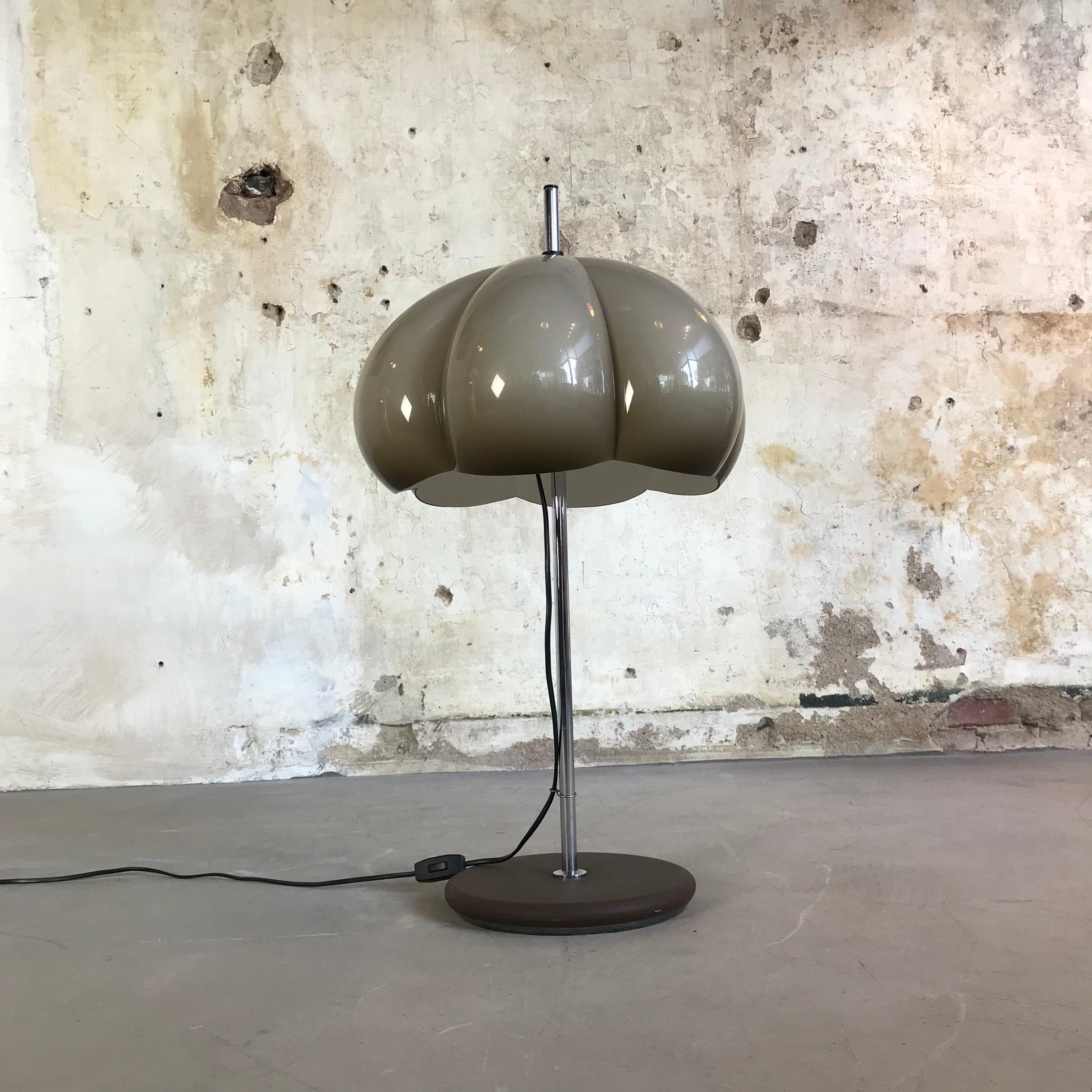 A beautiful, very rare and iconic lamp from the 1960s from the Atomic Mushroom Design series. A metal stand and a 'pumpkin' Plexiglas lampshade, adjustable in height. Manufactured by Dijkstra Lamps – the oldest Dutch lamp manufacturer established in