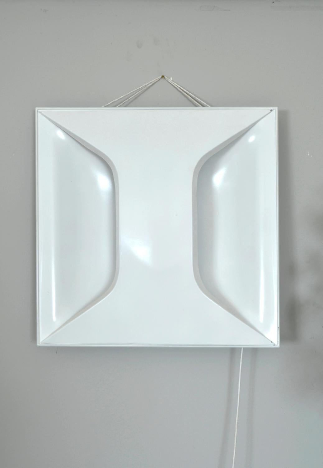 This incredibly futuristic lamp was designed by Dieter Witte and Rolf Krüger (model A247), for the German design house Staff Leuchten for the 1965 World's Fair in Munich.
It can be hung as an art light on the wall, stood in a corner as a floor