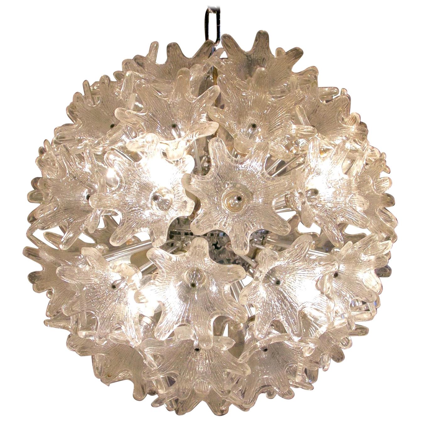 Large Murano Sputnik ball chandelier designed by Paolo Venini for VeArt Italy with clear glass flowers and a chrome structure. The lamp takes eight small Edison E14 bulbs.