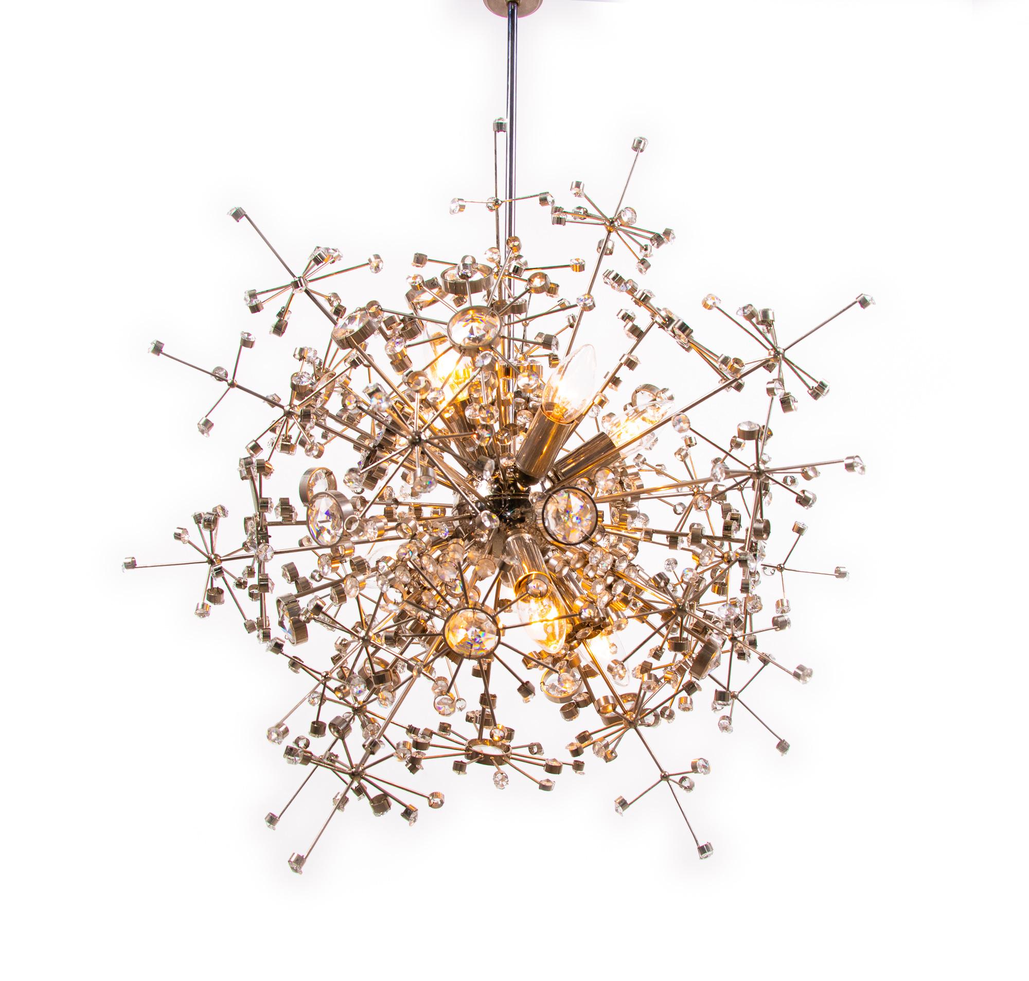 Outstanding mid century Sputnik chandelier made of a chromed nickel construction with Swarovski crystals. Designed by Christoph Palme. Chandelier illuminates beautifully and offers a lot of light. Gem from the time. With this light you make a clear