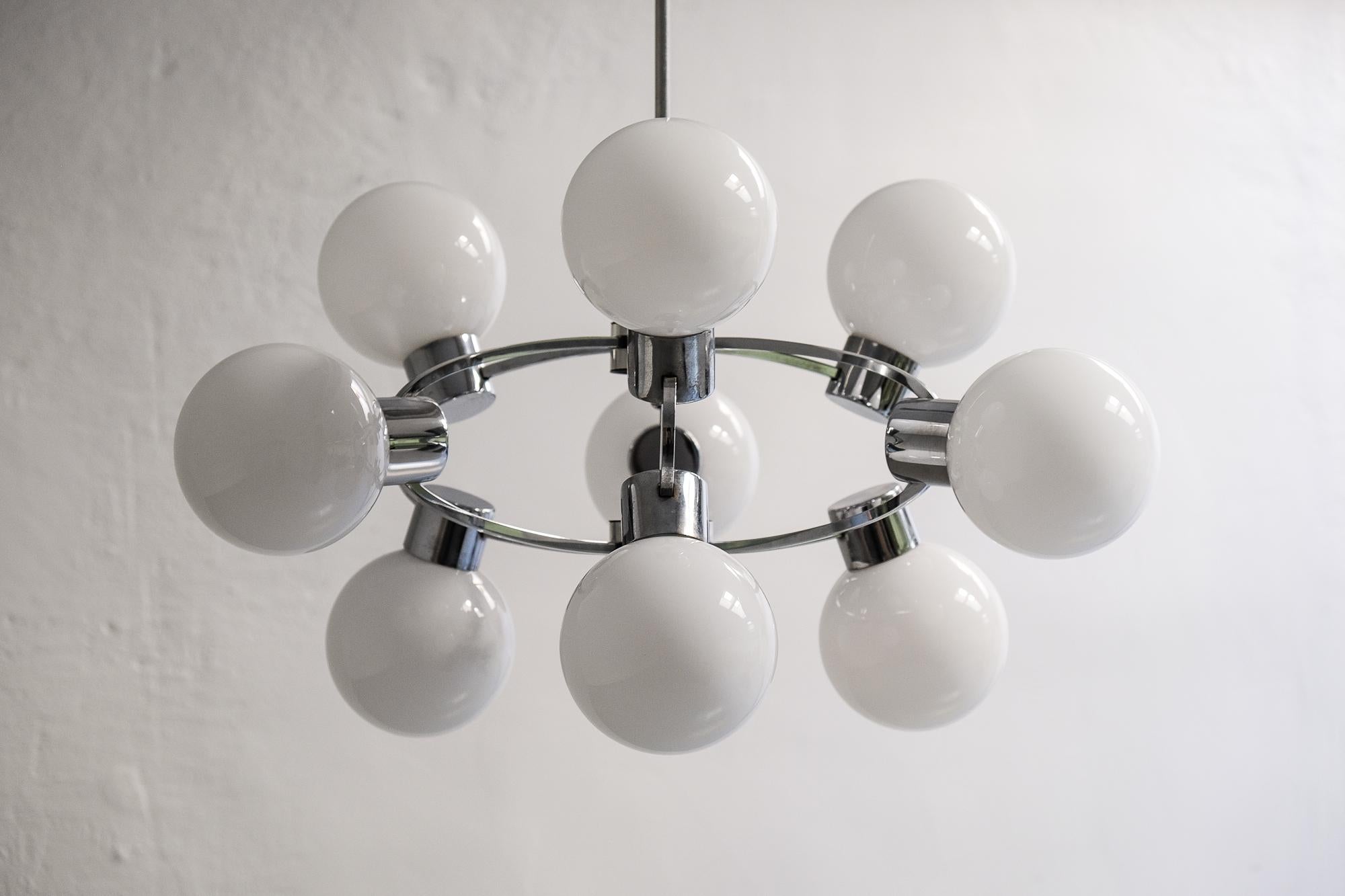 1970s Sputnik chandelier with nine beautiful opaline glass globes. Manufactured in Germany.