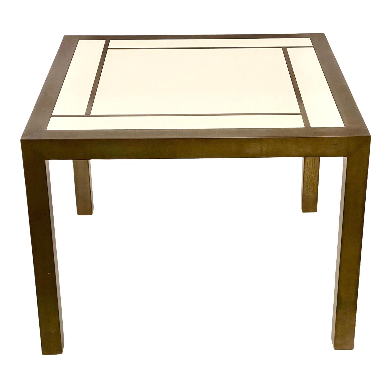 Fantastic midcentury brass and Formica laminate side table. This wonderful piece is inspired by Willy Rizzo and was designed in Italy in the 1970s.

This amazing item has brass finishes with a beautiful patina in contrast with the light color of