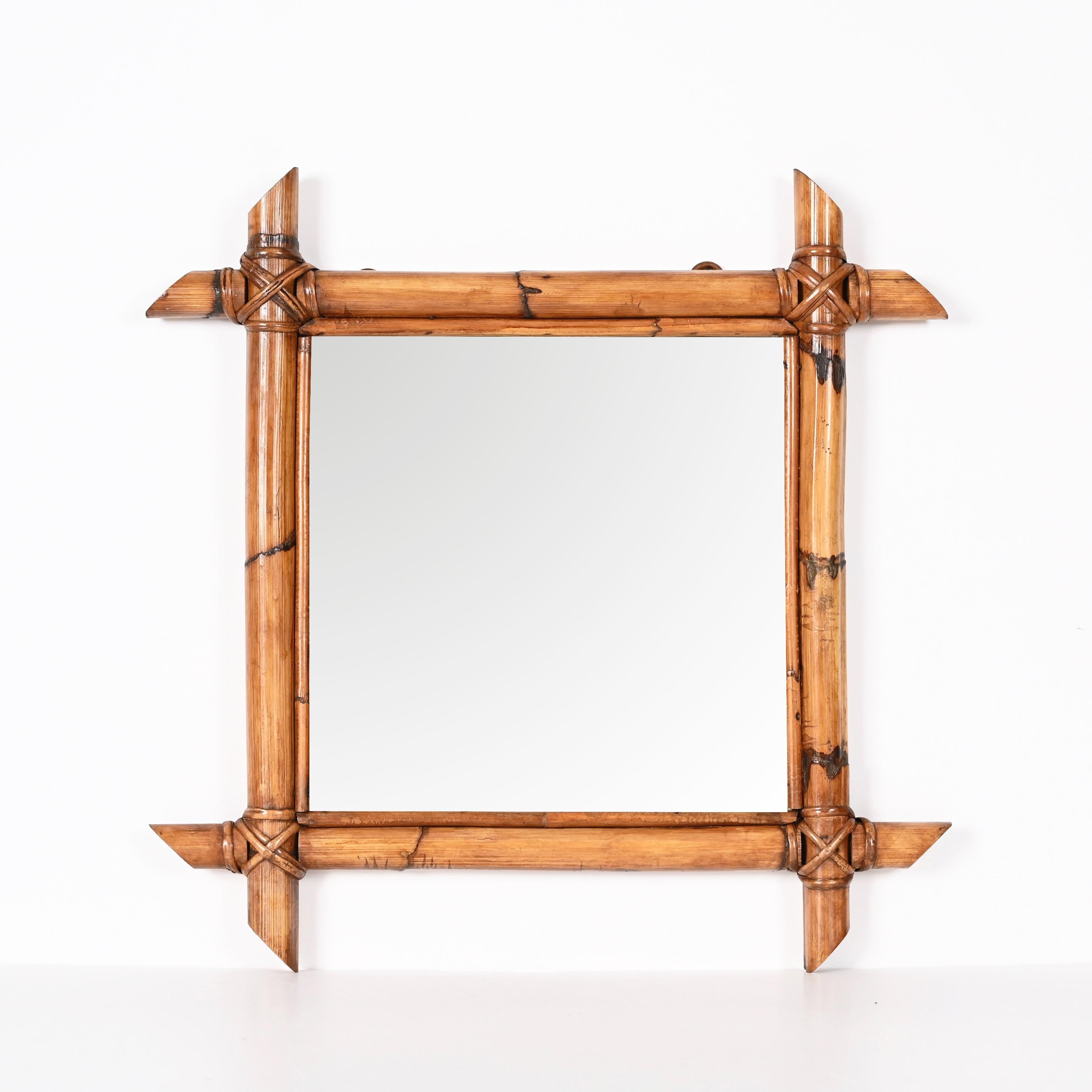 Amazing mid-century square mirror with bamboo woven wicker frame. This fantastic item was produced in Italy during the 1950s.

The way in which bamboo lines and glass integrate is fantastic and gives to this mirror an everlasting charm, the French