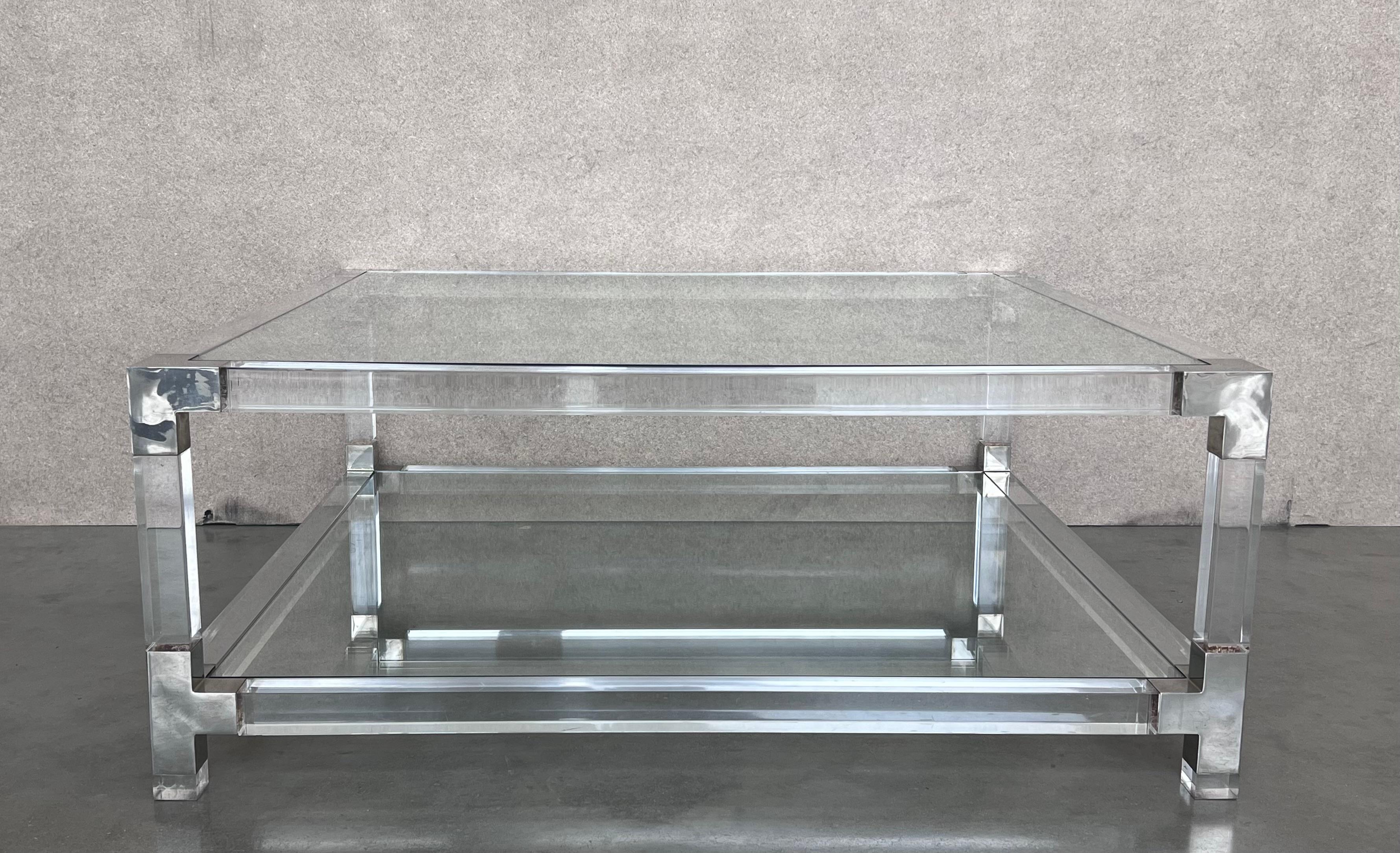 Pair of midcentury square lucite coffee tables with chromed metal details.

We have matching pair square coffee table available 60cm x 60cm.
