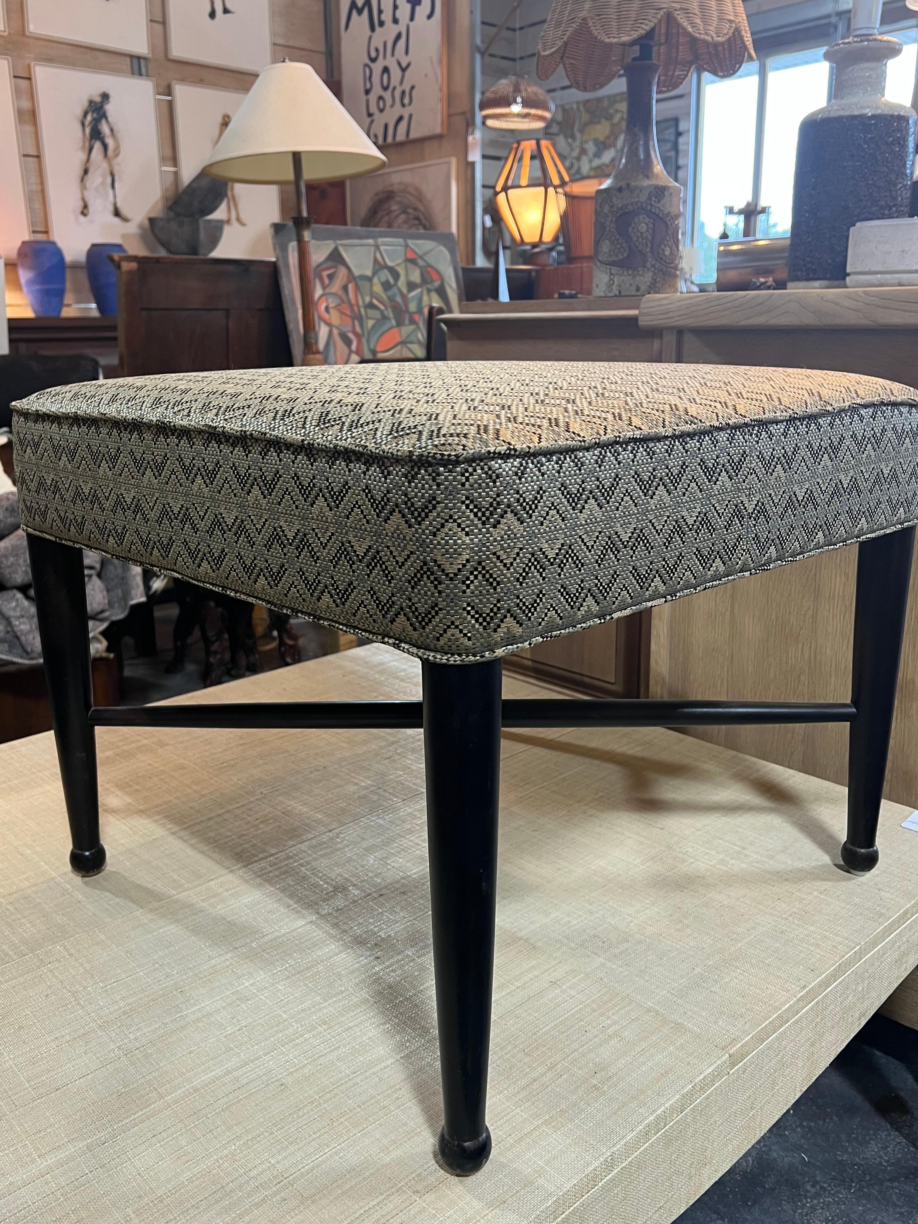 Midcentury square ottoman with wood base. This ottoman was made in style of Edward Wormley for Dunbar. New upholstery. Two ottomans are available. 