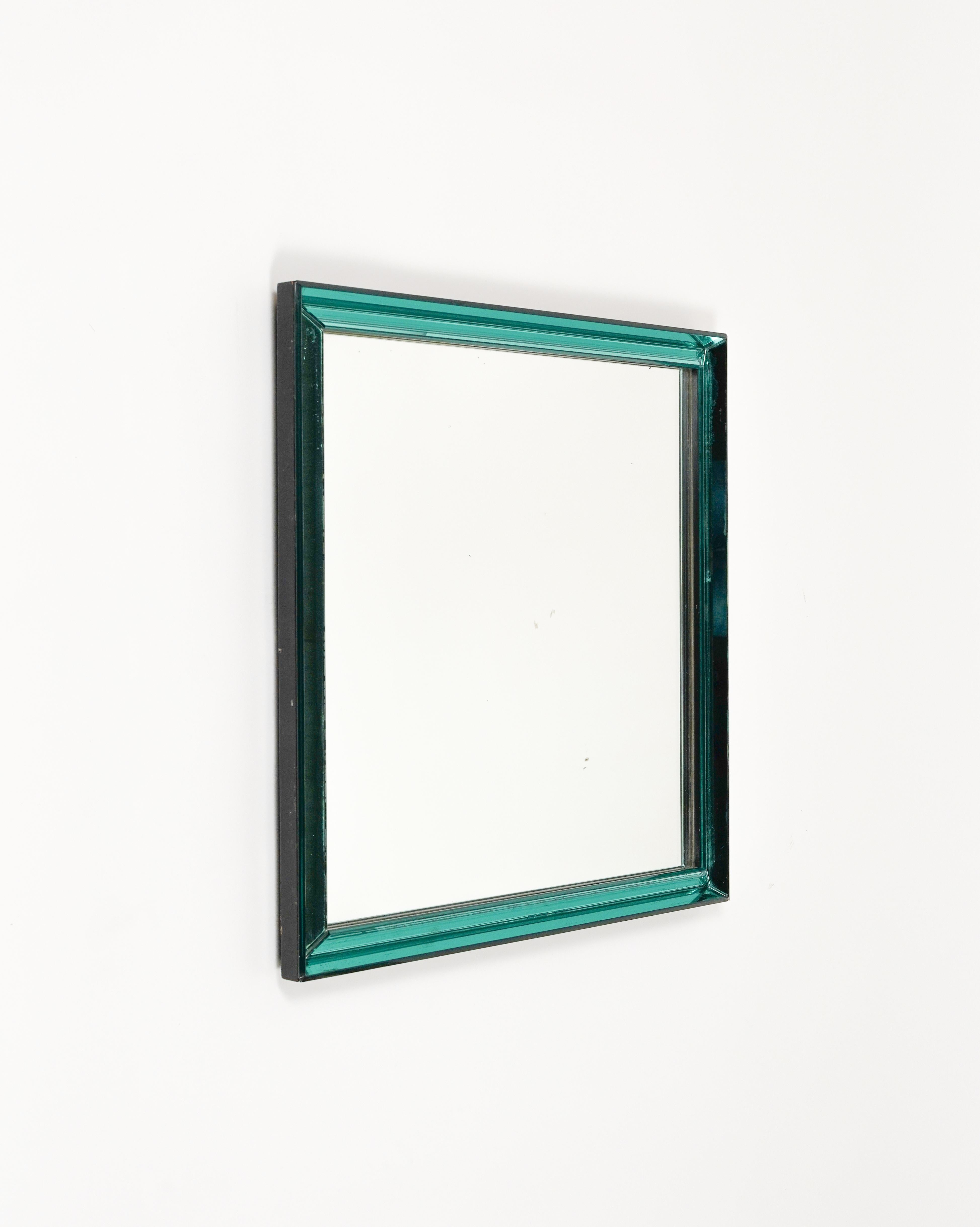 Midcentury amazing squared wall mirror model 2377 mirrored coloured cut glass frame black wood fitting by Max Ingrand for Fontana Arte.

Made in Italy 29 - January - 1965.

The original stamp is still visible on the back, as shown in the