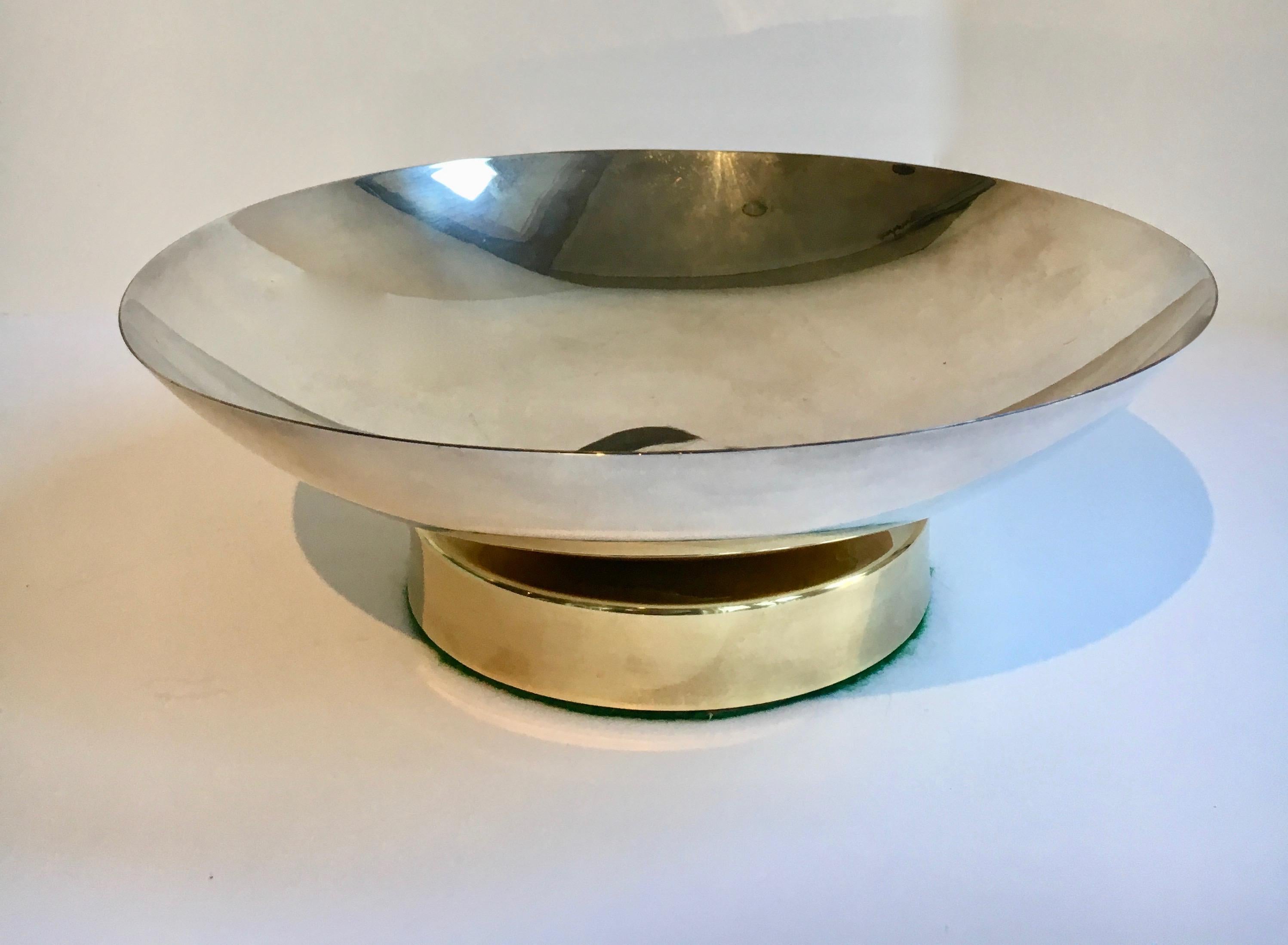 Midcentury stainless and brass footed bowl, a sleek and modern bowl, simple and elegant alone, it also ready for any shelf or desk. Also perfect for the guest room... gifts, holiday- a ribbed brassfoot for the excitement.