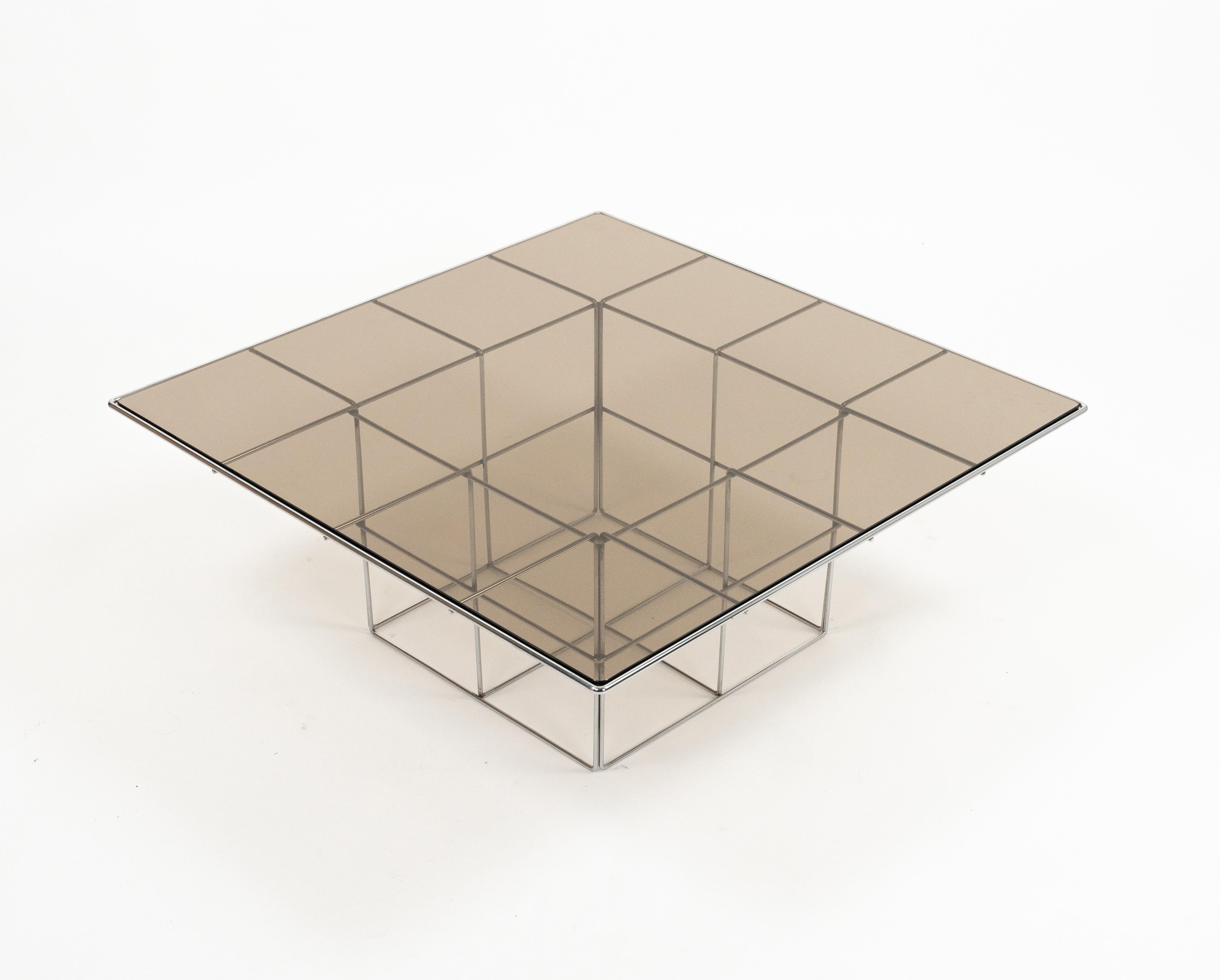 Midcentury amazing coffee table with a smoked glass surface and a steel base that reminds of a cage in the stylke of Verner Panton.

Made in Italy in the 1970s.