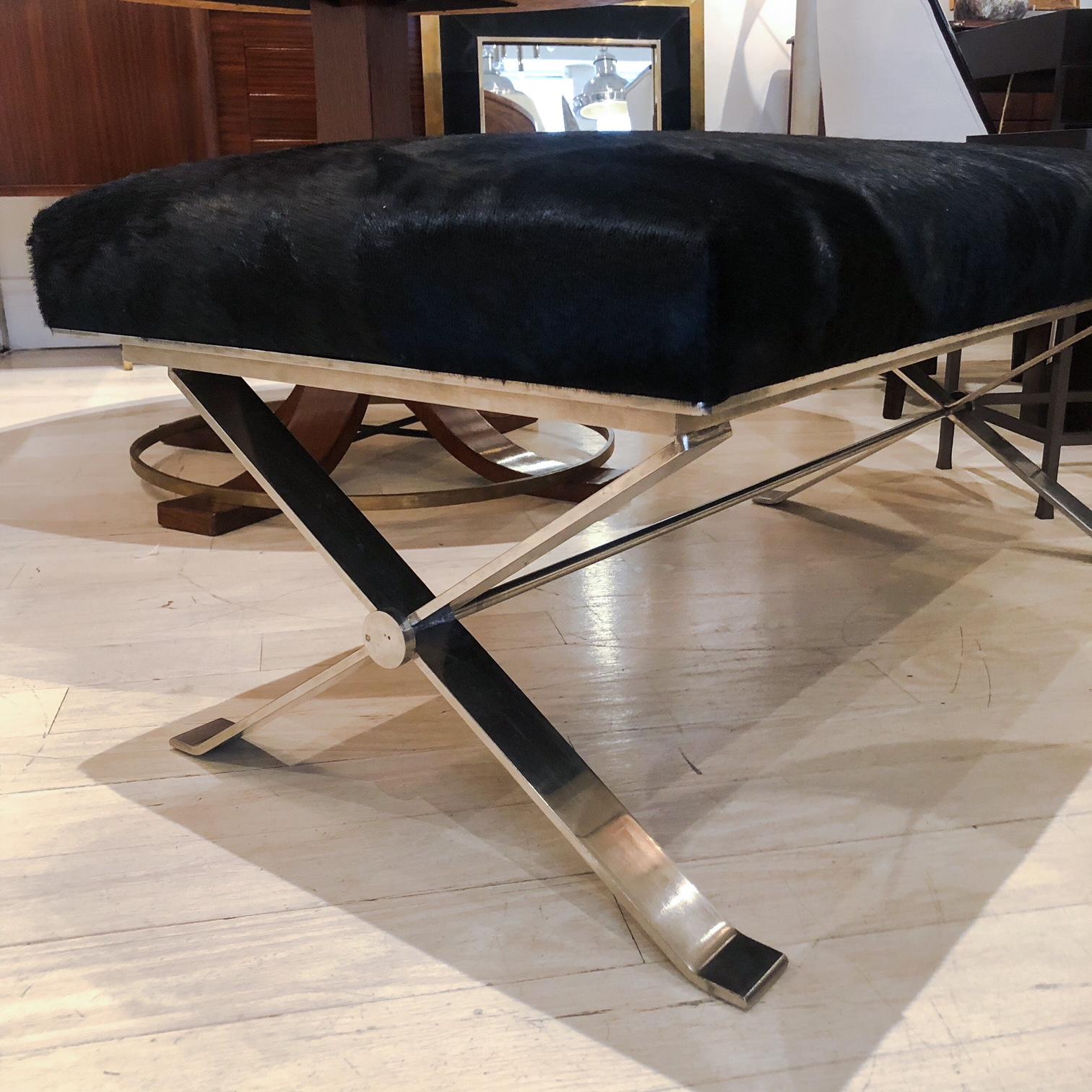 Rectangular midcentury polished steel X-form bench. Newly upholstered black horse hair seat. France, circa 1950.

Size: 45” W, 21.5” D, 18.5” H.

 