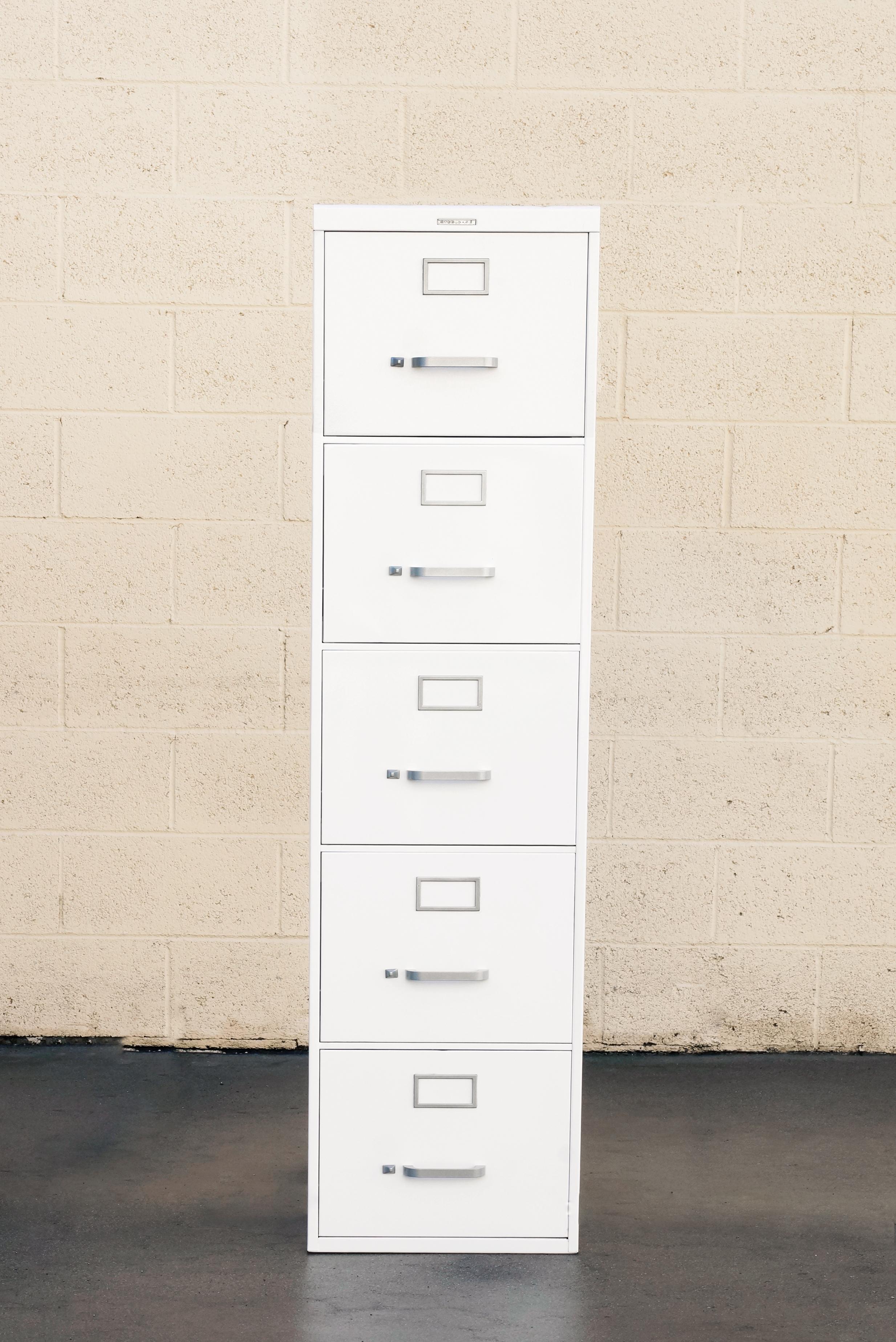 1970s tanker style steel file cabinet refinished in gloss white with brushed aluminum hardware. Vertical 5-drawer configuration. The pictured model is by Steelcase. Please note, our file cabinets are refinished to order; the models we refinish are