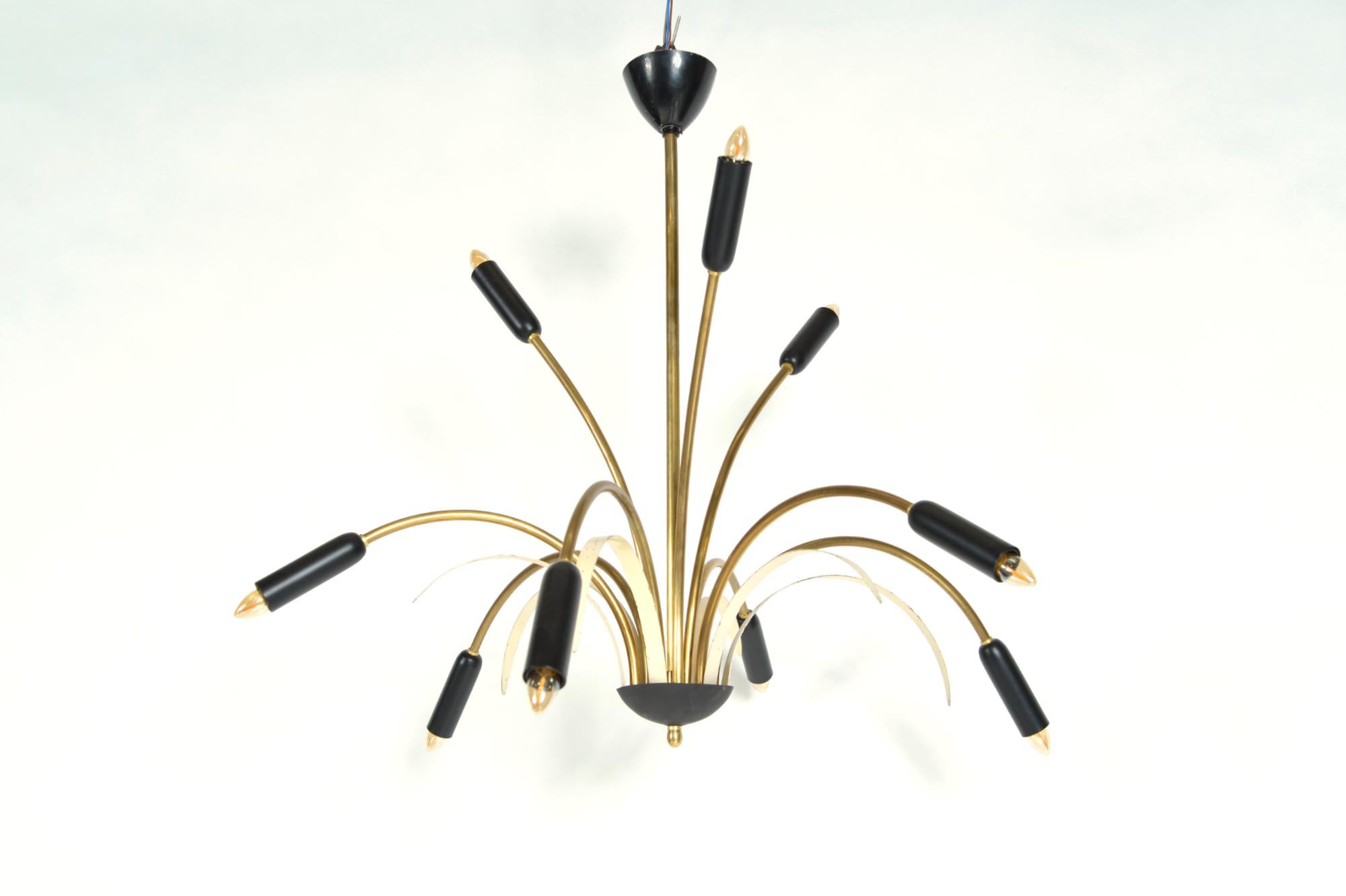 A very elegant, Italian nine-arm ‘spider’ pendant light by Stilnovo dating from the 1950s. Each of the six lower brass reed arms is accompanied by six copper leaves finished in a cream enamel, which cascade downwards, whilst the top three sit high
