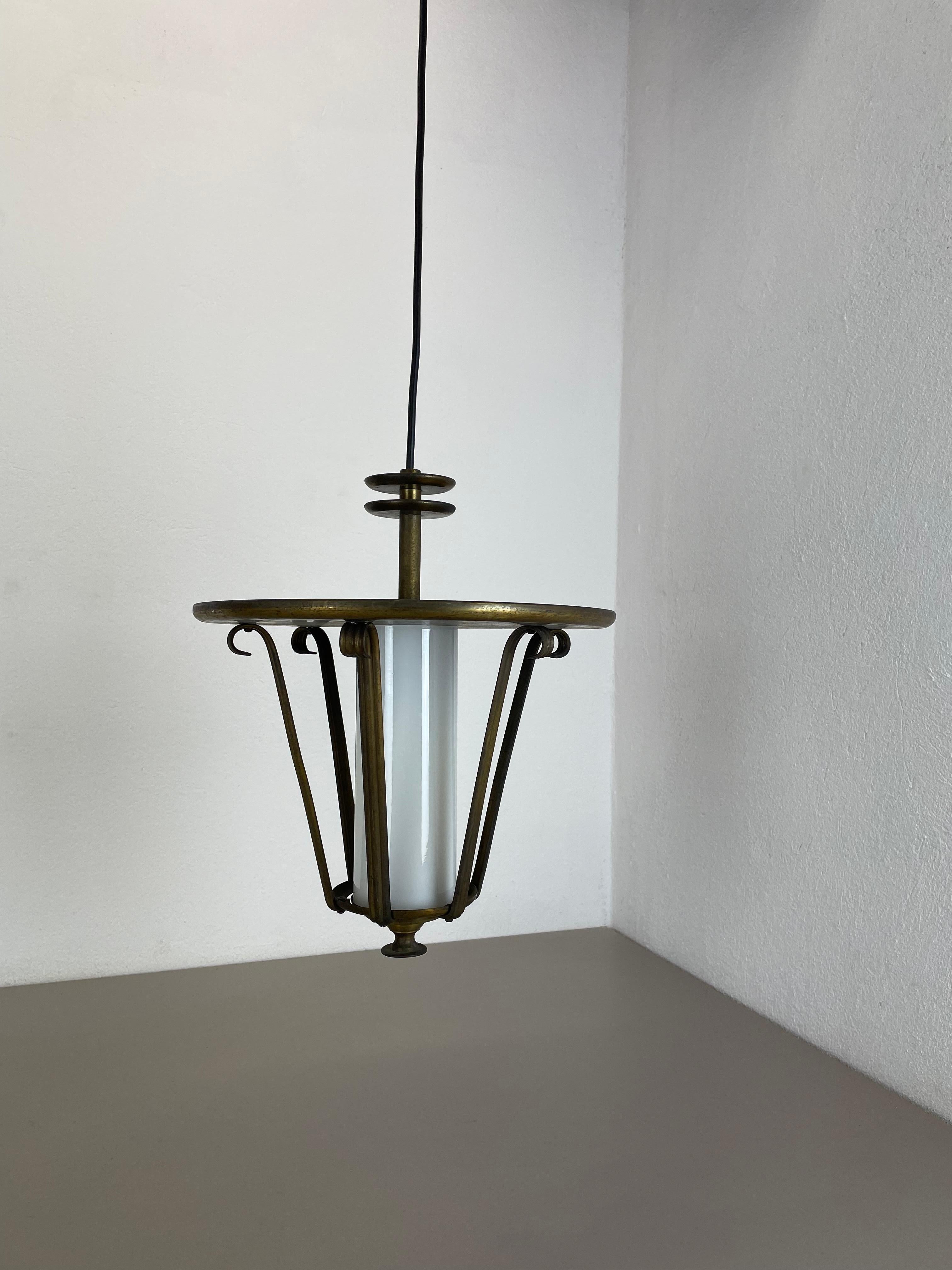 Article: Hanging light 


Origin: Italy


Age: 1950s


 

This fantastic glass hanging light was designed and produced in 1950s in Italy. The shade is made of high quality brass and metal with a nice tube formed white glass shade in the