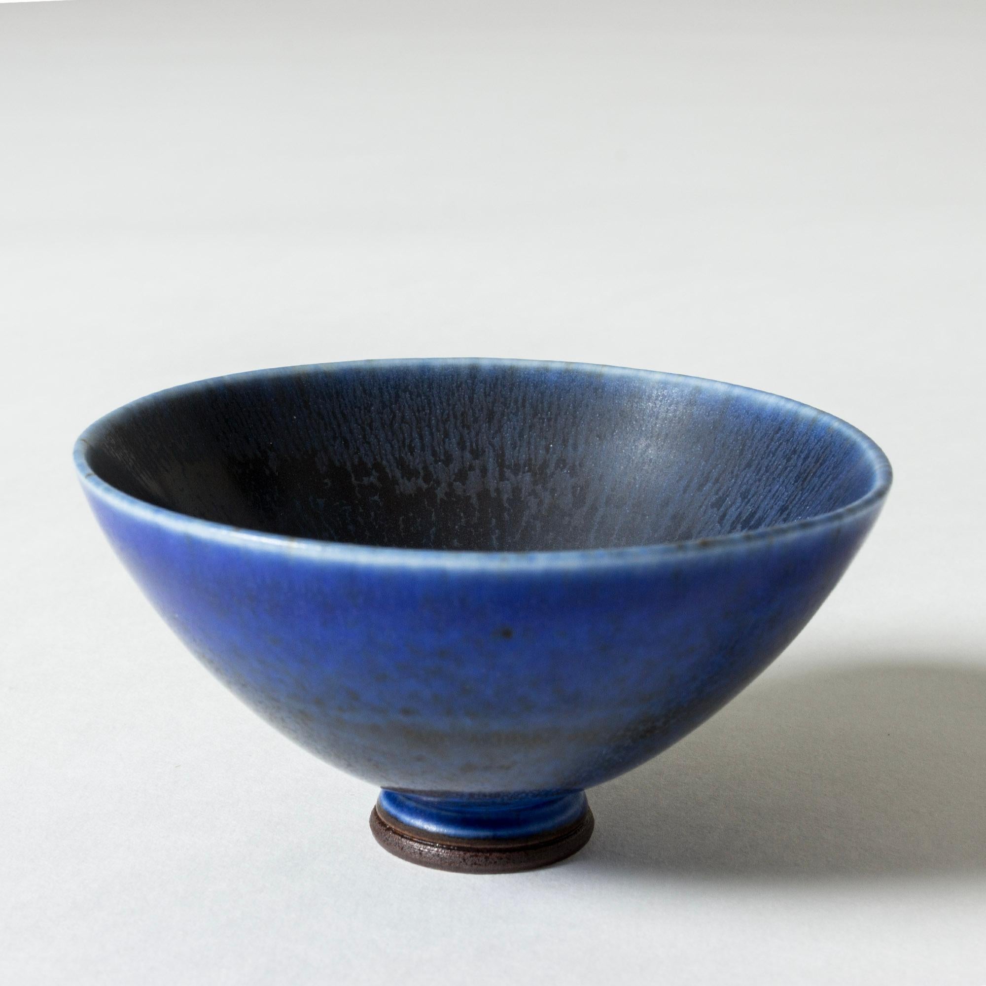 Lovely miniature stoneware bowl by Berndt Friberg. Round form, elegant blue hare’s fur glaze.

Berndt Friberg was a Swedish ceramicist, renowned for his stoneware vases and vessels for Gustavsberg. His pure, composed designs with satiny, compelling