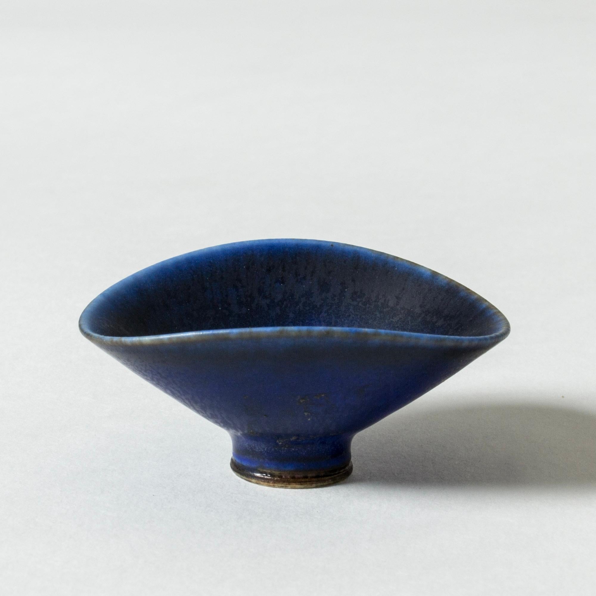 Precious miniature stoneware bowl by Berndt Friberg in an oval form, blue hare’s fur glaze.

Berndt Friberg was a Swedish ceramicist, renowned for his stoneware vases and vessels for Gustavsberg. His pure, composed designs with satiny, compelling