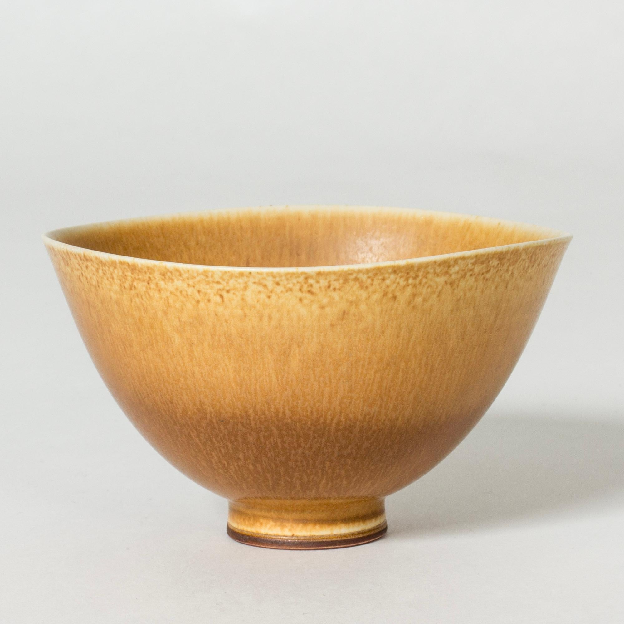 Lovely stoneware bowl by Berndt Friberg. Delicate, undulating edge. Caramel colored hare’s fur glaze, darker at the base, light at the top.

Berndt Friberg was a Swedish ceramicist, renowned for his stoneware vases and vessels for Gustavsberg. His
