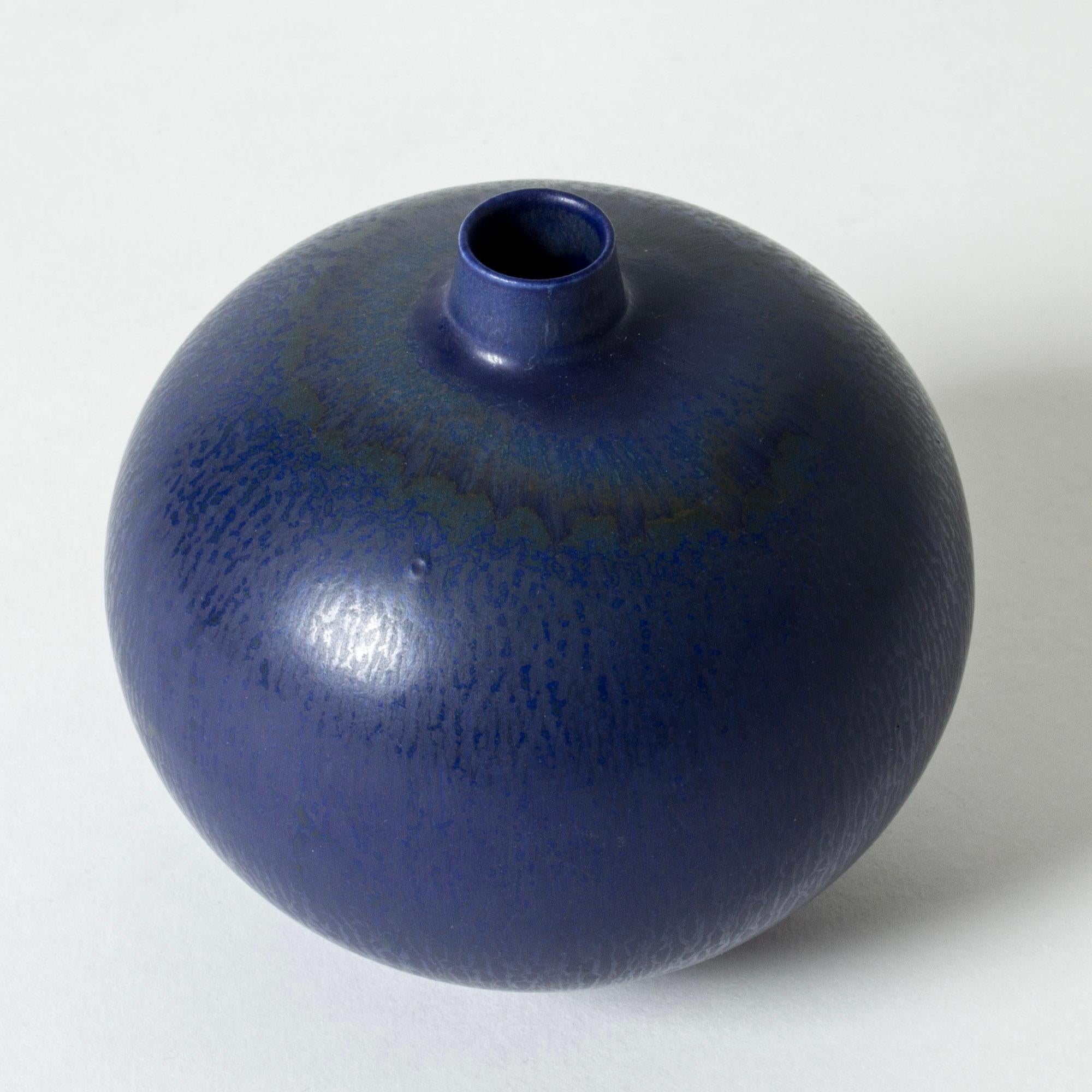 Early stoneware vase by Berndt Friberg, in a round form with a short cylinder formed neck. Rich blue hare’s fur glaze.

Berndt Friberg was a Swedish ceramicist, renowned for his stoneware vases and vessels for Gustavsberg. His pure, composed