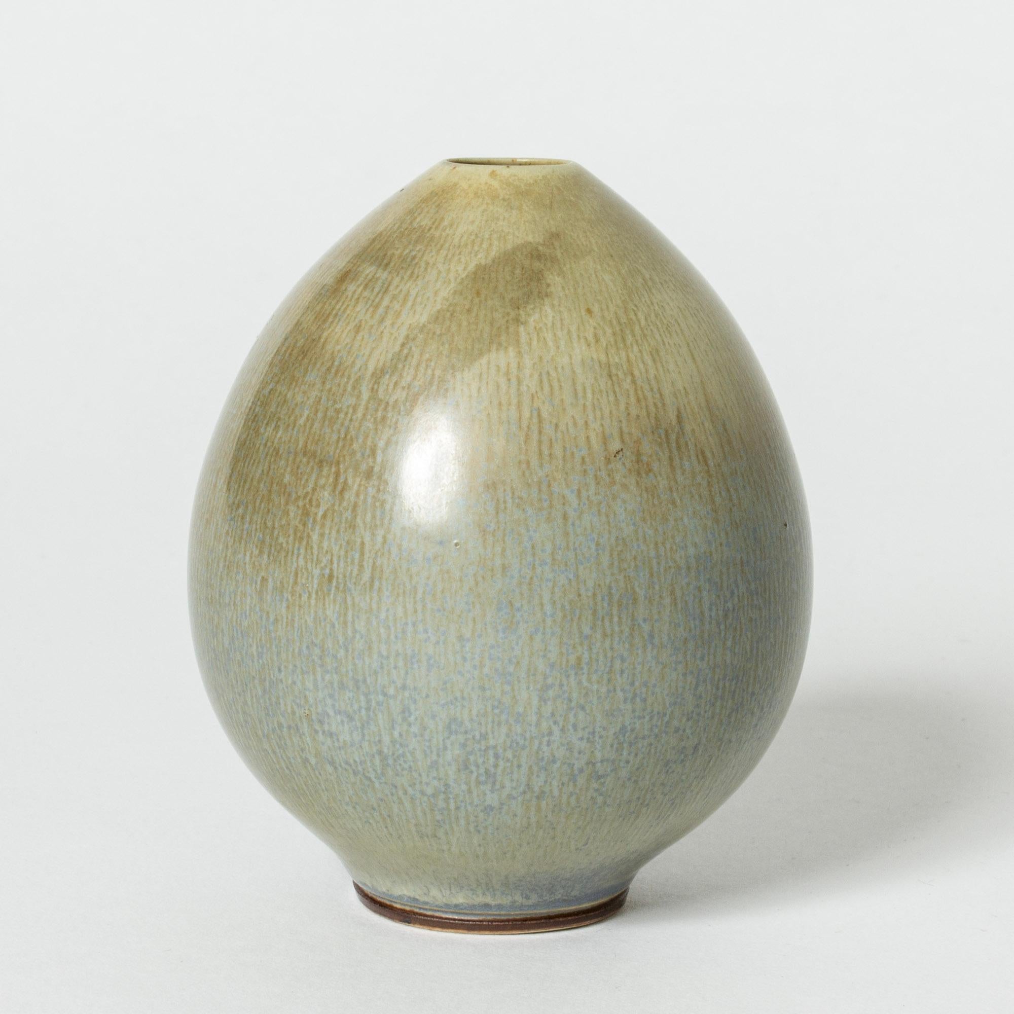 Beautiful miniature stoneware vase by Berndt Friberg, in an egg form with a small opening at the top. Ocean blue and greenish, tactile looking hare’s fur glaze.

Berndt Friberg was a Swedish ceramicist, renowned for his stoneware vases and vessels