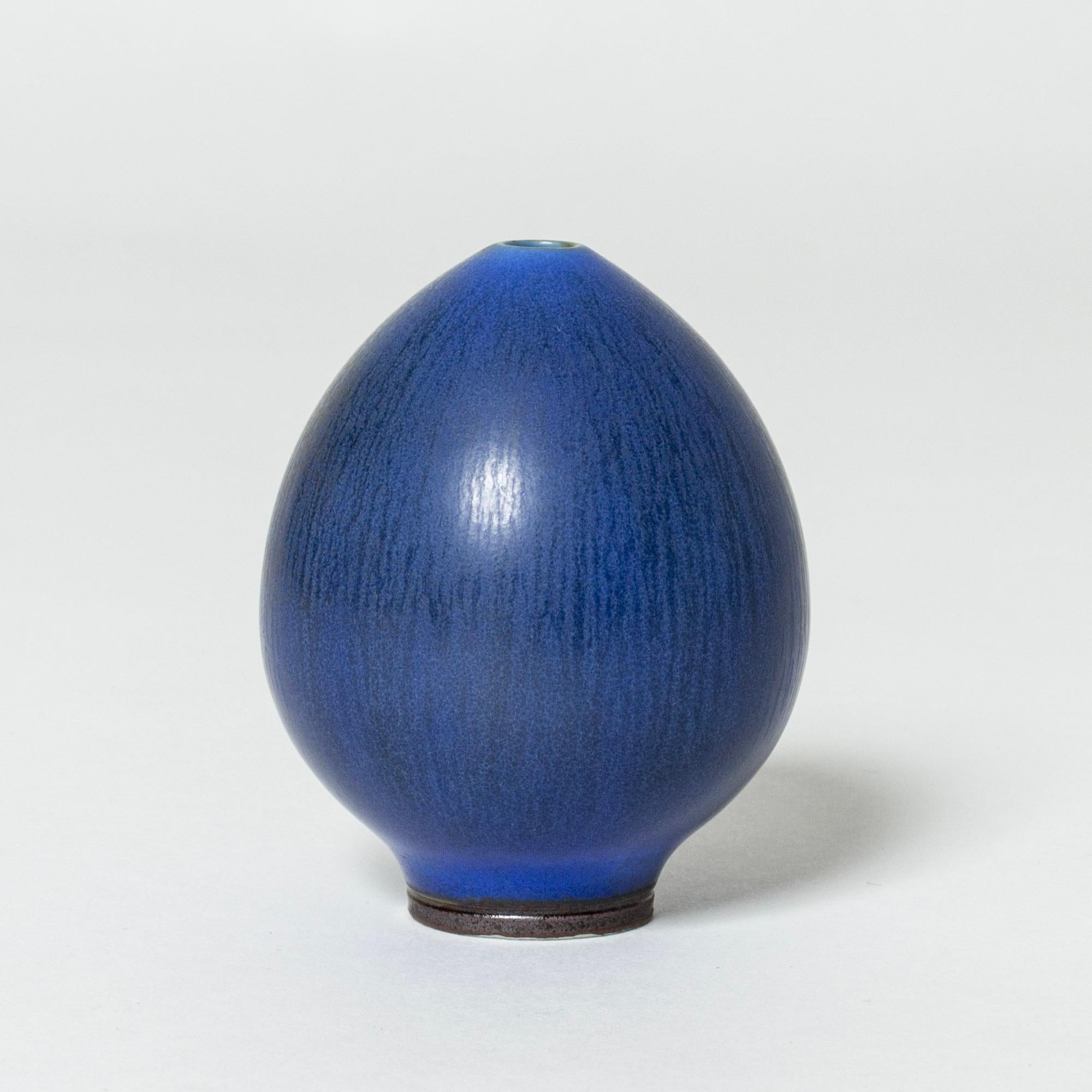 Lovely, small stoneware vase by Berndt Friberg, in the form of an egg. Beautiful, intense blue hare’s fur glaze.

Berndt Friberg was a Swedish ceramicist, renowned for his stoneware vases and vessels for Gustavsberg. His pure, composed designs